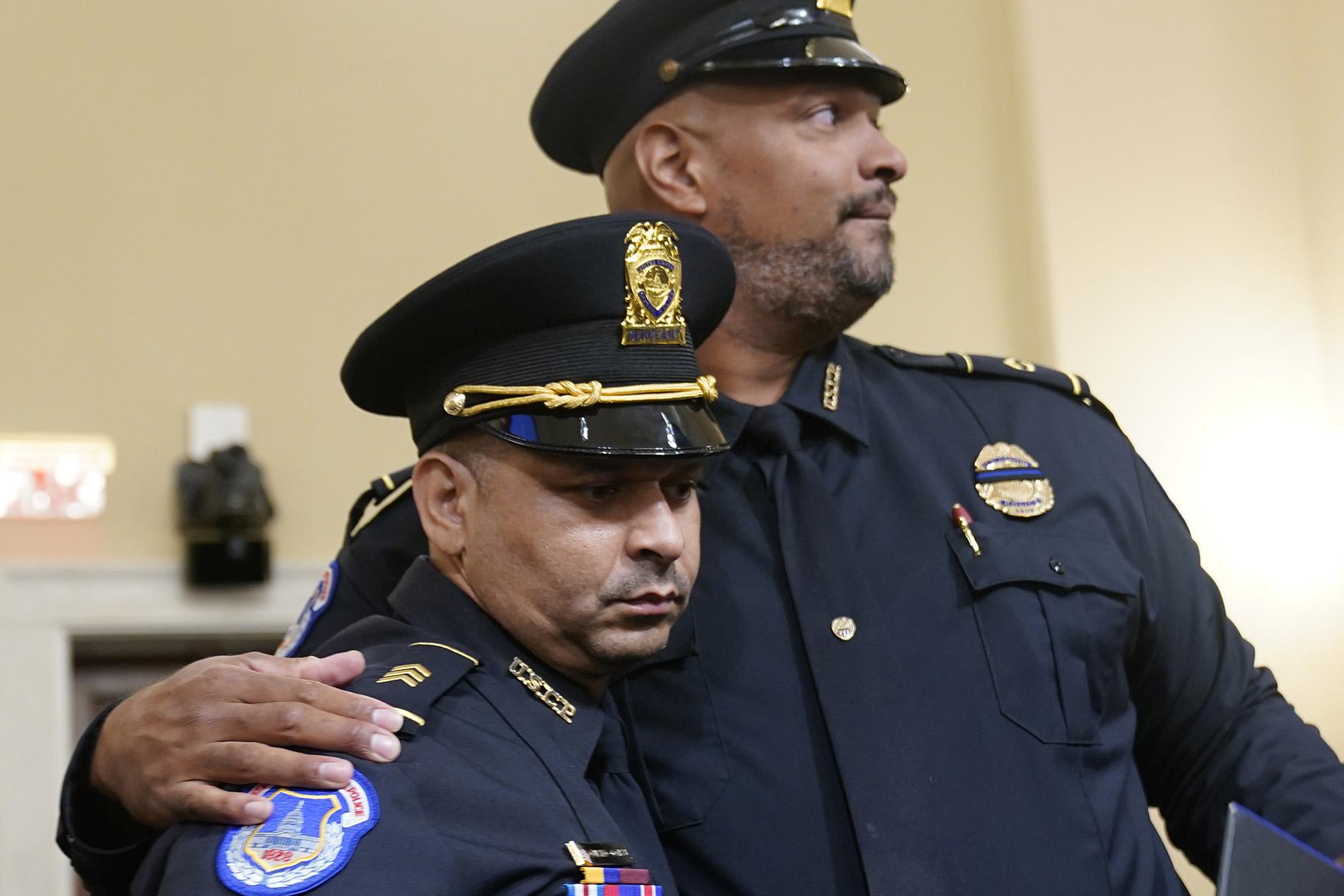 U.S. Capitol Police Sgt. Aquilino Gonell left, and U.S. Capitol Police Sgt. Harry Dunn stand after the House select committee hearing on the Jan. 6 attack on Capitol Hill in Washington, Tuesday, July 27, 2021. (AP Photo / Andrew Harnik, Pool)