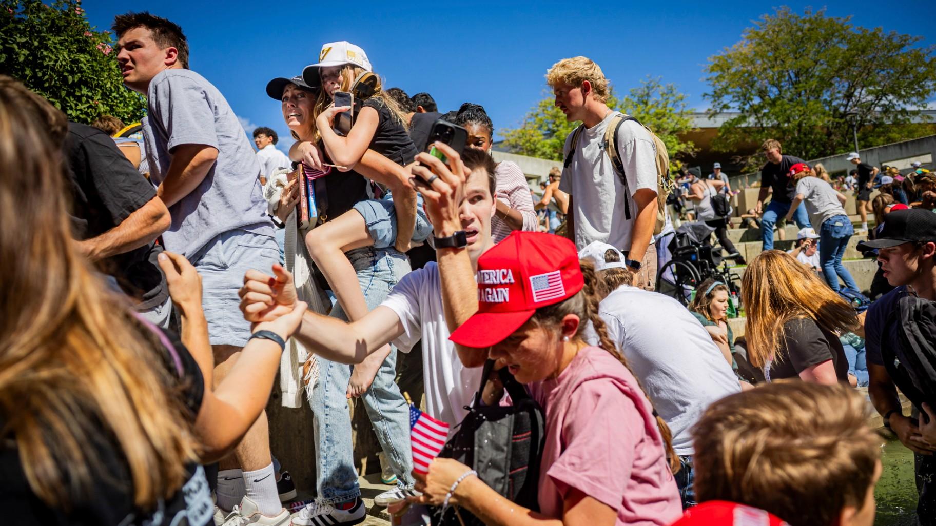 The crowd reacts after Charlie Kirk, the CEO and co-founder of the conservative youth organization Turning Point USA, is shot at the Utah Valley University Wednesday, Sept. 10, 2025, in Orem, Utah. (Tess Crowley/The Deseret News via AP)