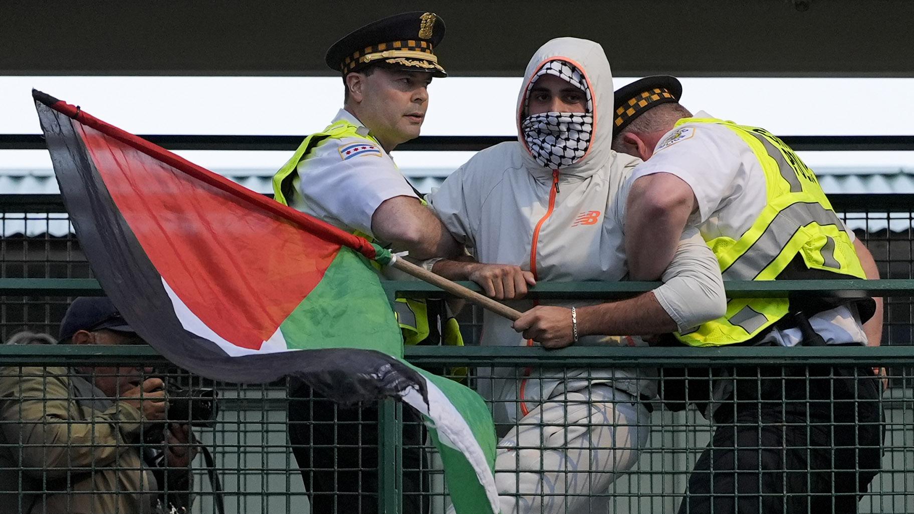 Police detain a protester during a demonstration outside the Democratic National Convention Wednesday, Aug. 21, 2024, in Chicago. (AP Photo/Alex Brandon)