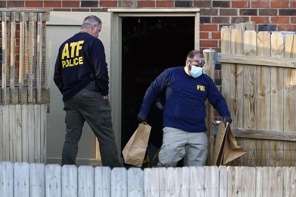 Investigators remove items from the basement of a home Saturday, Dec. 26, 2020, in Nashville, Tenn. (AP Photo / Mark Humphrey)