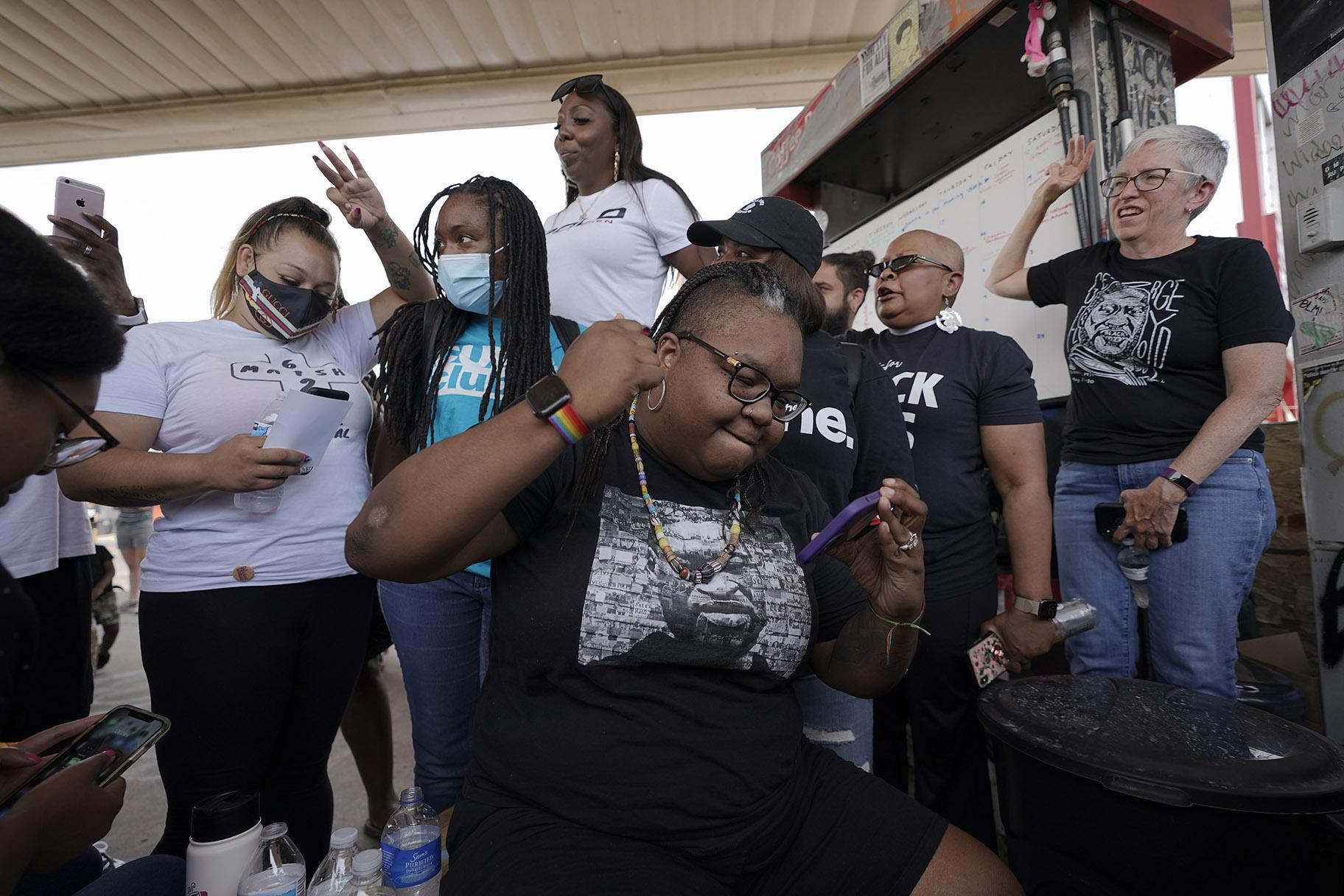 Jennifer Starr Dodd, center, and other supporters react to the sentencing of former Minneapolis police Officer Derek Chauvin for the murder of George Floyd, Friday, June 25, 2021, at George Floyd Square where Floyd was killed, in Minneapolis. Chauvin was sentenced to 22 1/2 years in prison. (AP Photo / Julio Cortez)