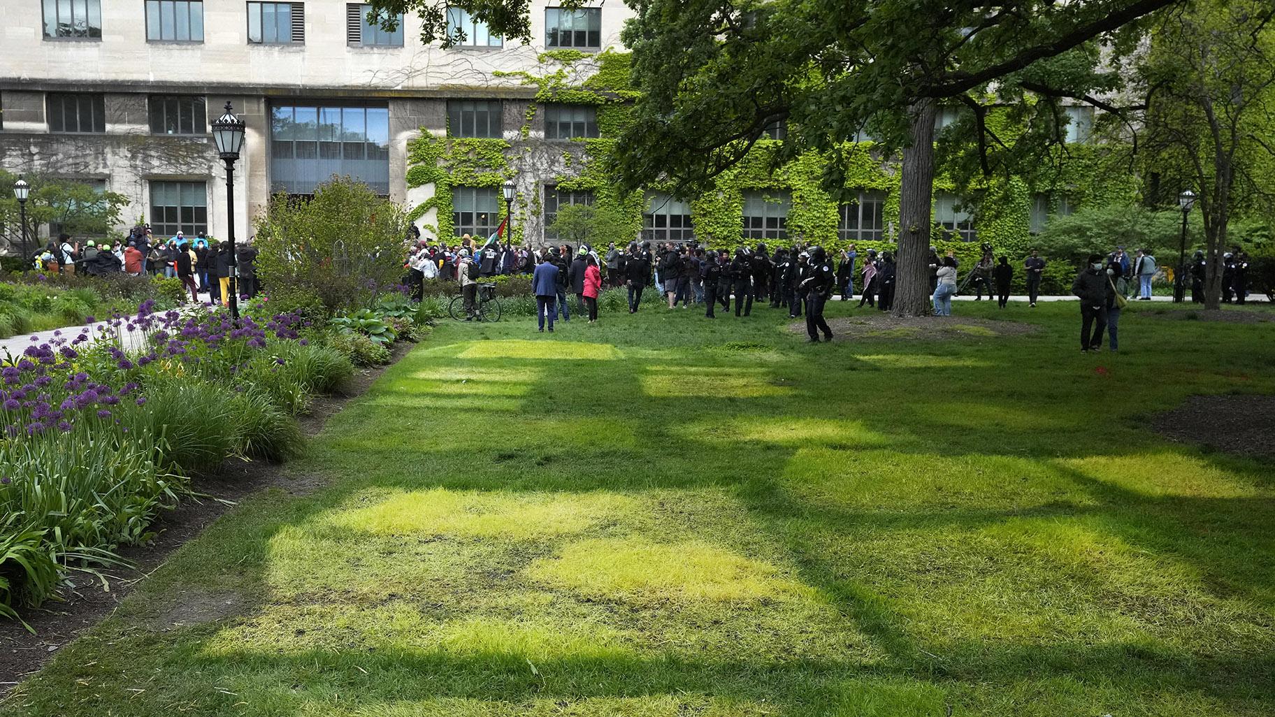 Pro-Palestinian protesters return to the University of Chicago's quad outside Levi Hall as as a patchwork of dying grass mark the locations of tents in an encampment that was dismantled in the pre-dawn hours by university police Tuesday, May 7, 2024, in Chicago. (AP Photo / Charles Rex Arbogast)