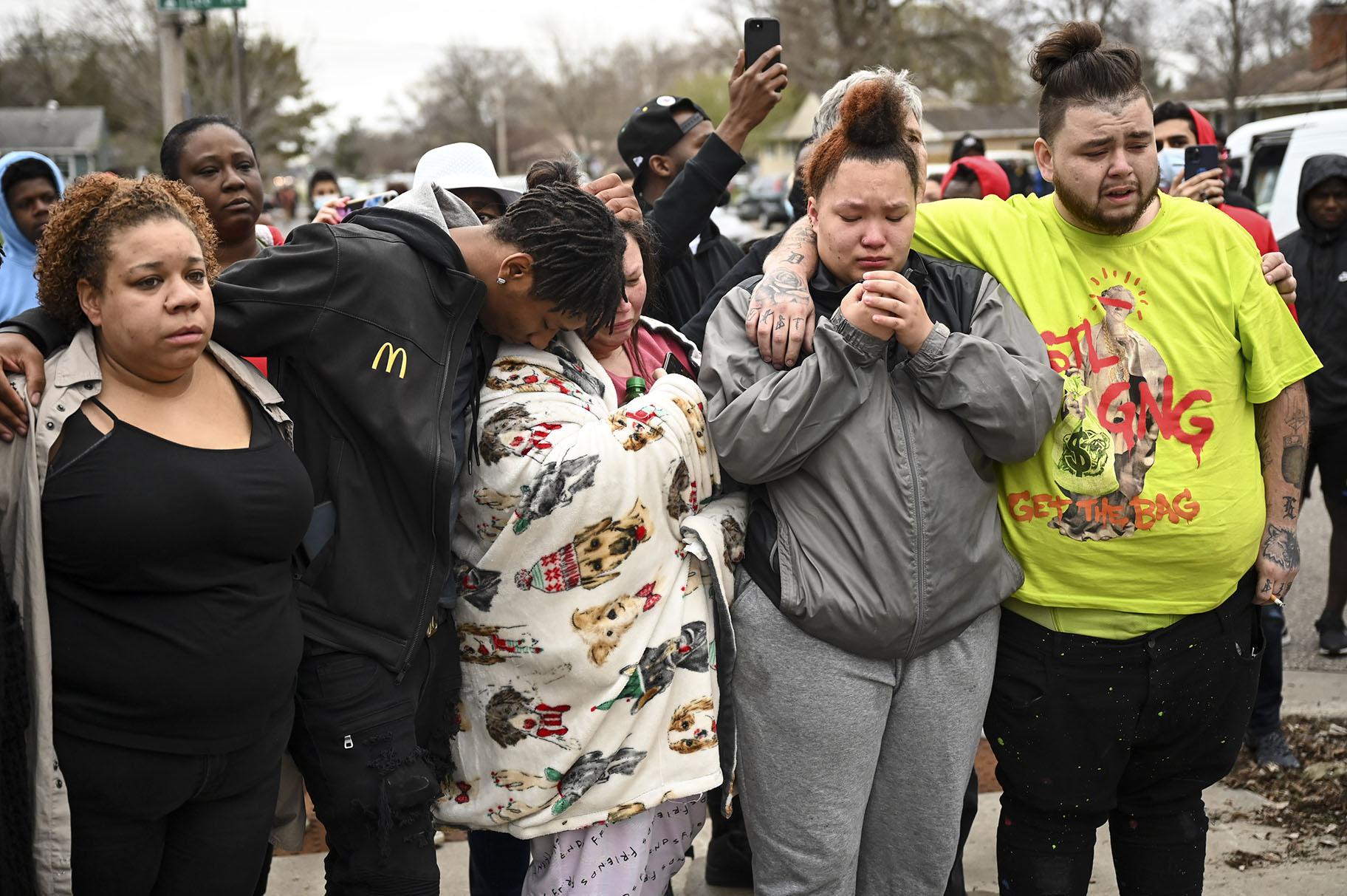 Family and friends of Daunte Wright, 20, grieve at 63rd Avenue North and Lee Avenue North hours after they say he was shot and killed by police, Sunday, April 11, 2021, in Brooklyn Center, Minn. Wright’s mother, Katie Wright, stands at center. (Aaron Lavinsky / Star Tribune via AP)