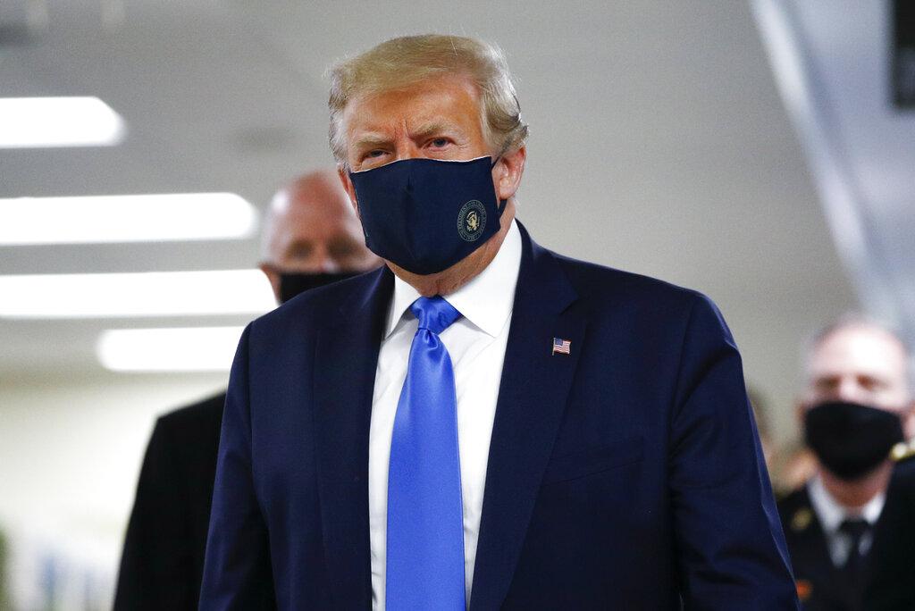 President Donald Trump wears a mask as he walks down the hallway during his visit to Walter Reed National Military Medical Center in Bethesda, Md., Saturday, July 11, 2020. (AP Photo / Patrick Semansky)