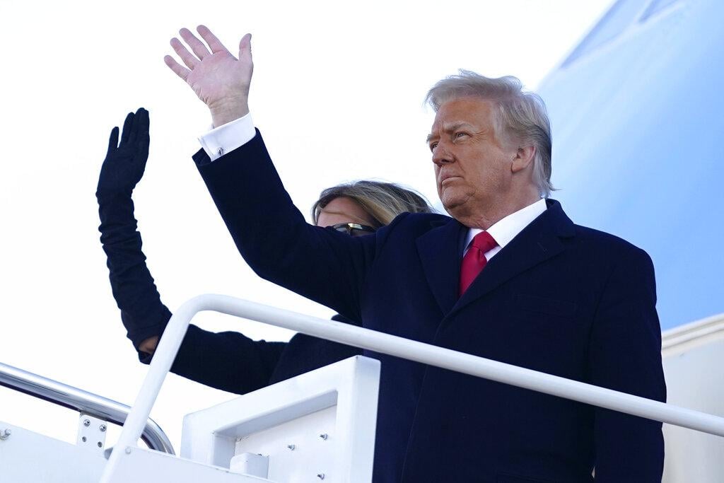 President Donald Trump and first lady Melania Trump board Air Force One at Andrews Air Force Base, Md., Wednesday, Jan. 20, 2021.(AP Photo / Manuel Balce Ceneta)