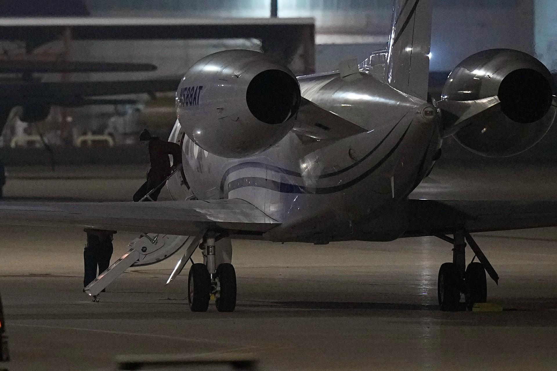 WNBA star Brittney Griner deplanes at Kelly Field in San Antonio, Texas, following her release in a prisoner swap with Russia, Friday, Dec. 9, 2022. (AP Photo/Eric Gay)