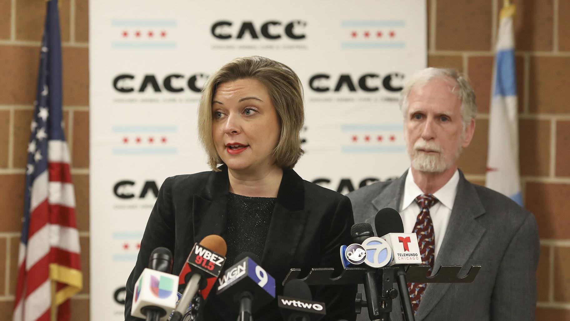 Kelley Gandurski, executive director of Chicago Animal Care and Control, speaks with reporters in Chicago, Thursday, Jan. 9, 2020, while Dr. Tom Wake, the interim administrator of Cook County Animal and Rabies Control, stands behind her. (AP Photo / Teresa Crawford)