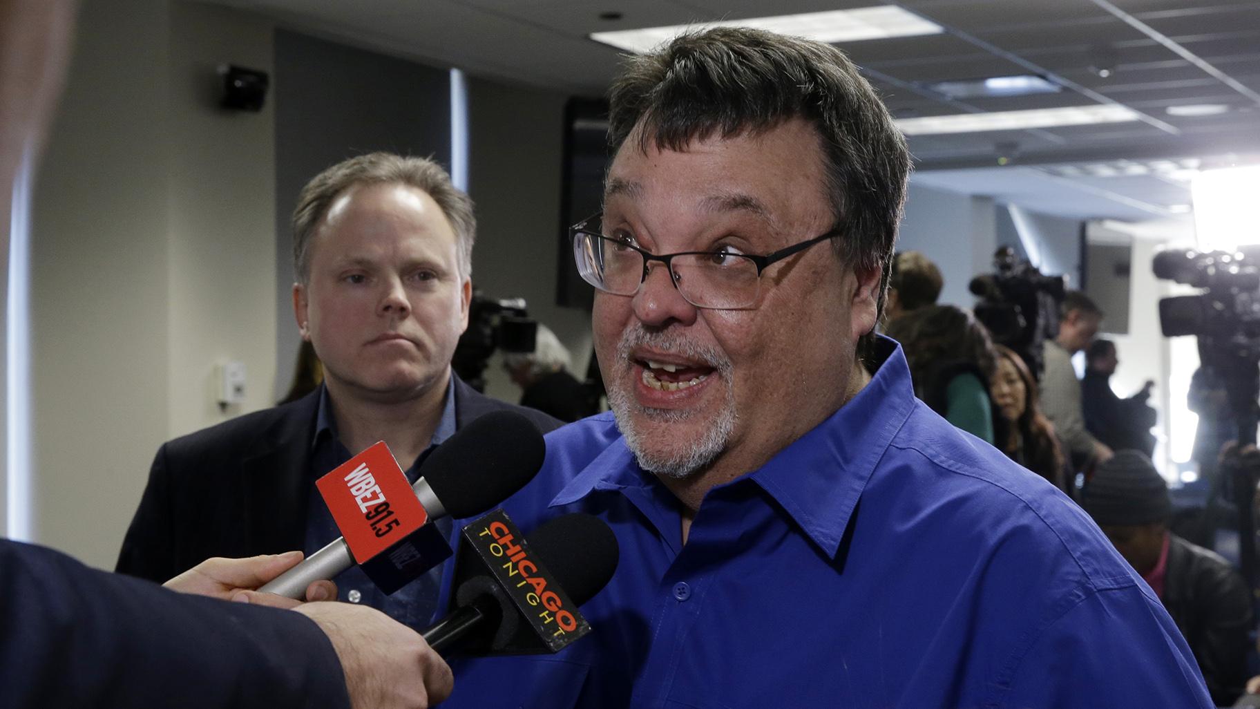 Former Chicago Sun-Times reporter Jim DeRogatis talks to Chicago Tonight and other reporters after a news conference by Cook County State’s Attorney Kim Foxx announcing charges against R. Kelly, the R&B star, with 10 counts of aggravated sexual abuse involving multiple victims in Chicago. (AP Photo / Kiichiro Sato)