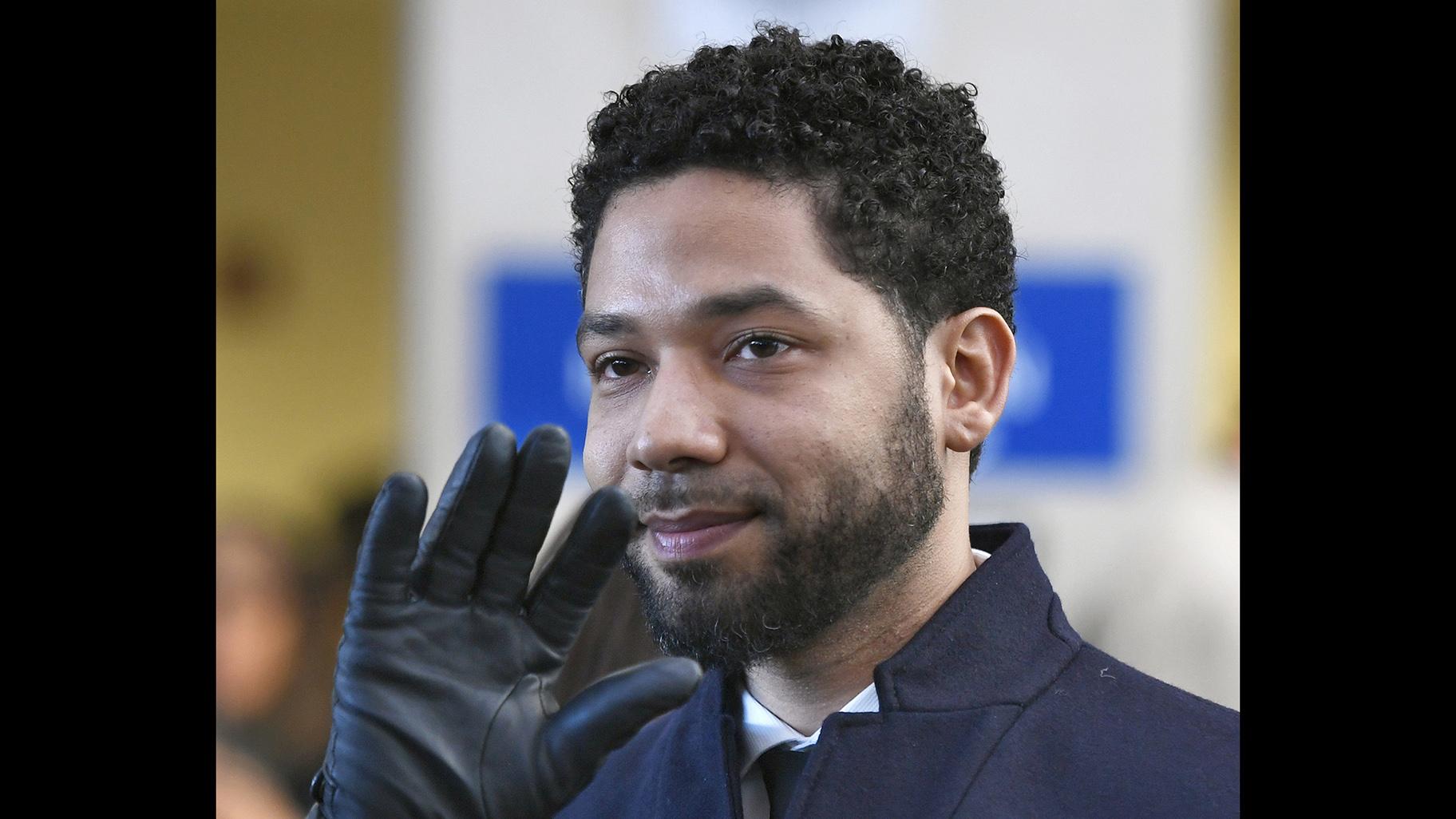 In this March 26, 2019, file photo, actor Jussie Smollett smiles and waves to supporters before leaving Cook County Court. (AP Photo / Paul Beaty, File)