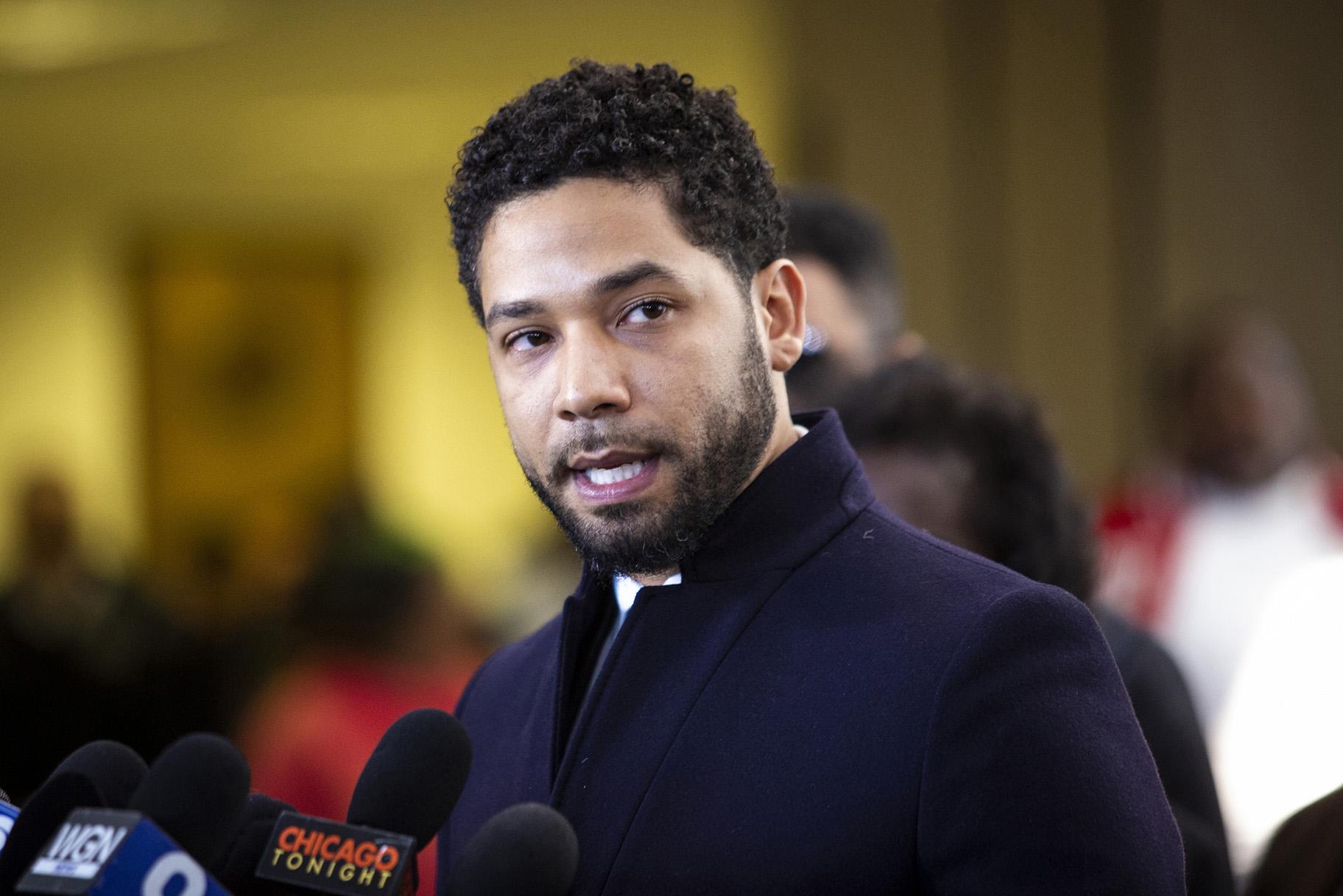 Actor Jussie Smollett leaves the Leighton Criminal Courthouse in Chicago on Tuesday March 26, 2019, after prosecutors dropped all charges against him. (Ashlee Rezin / Chicago Sun-Times via AP)