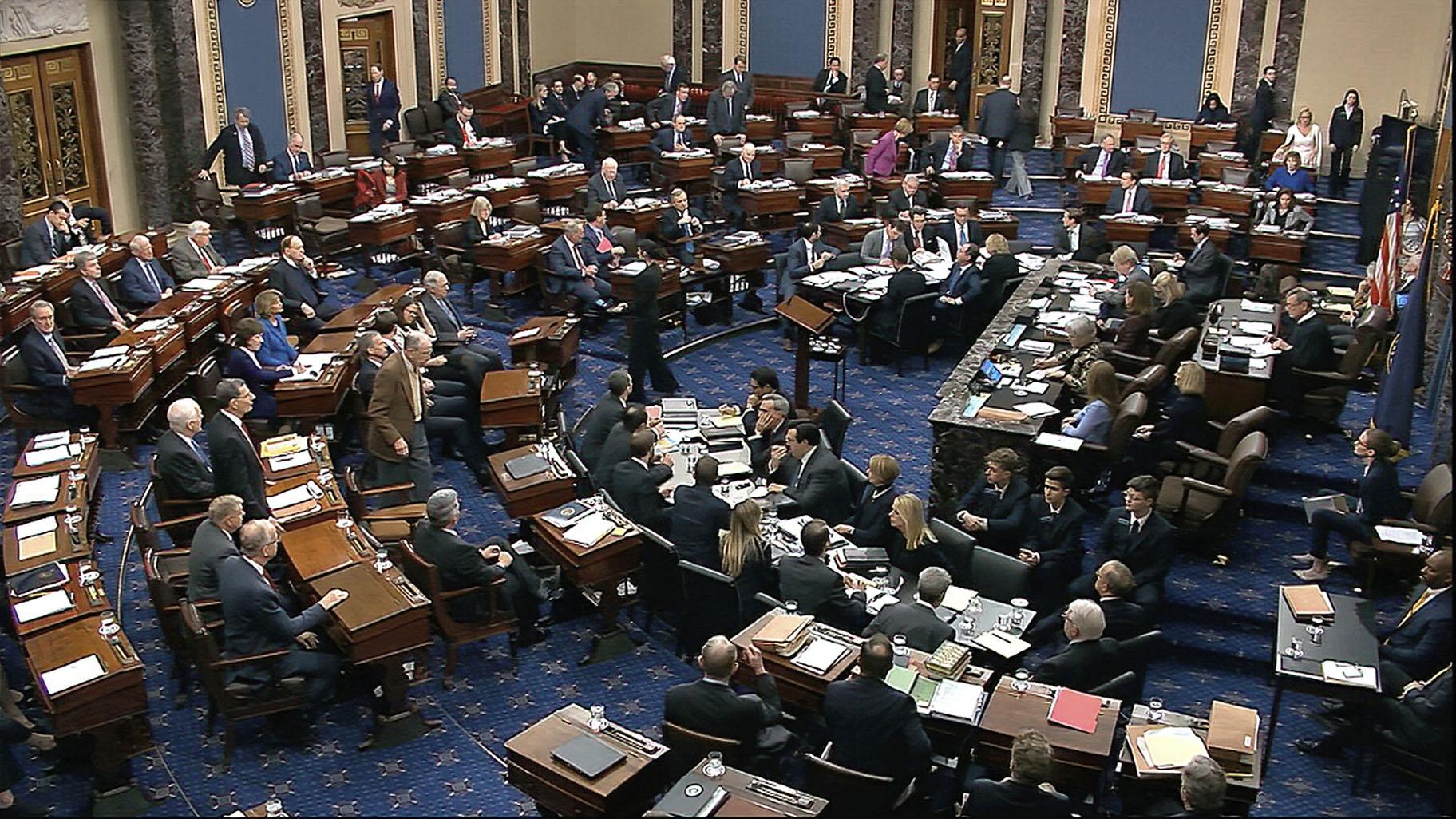 In this image from video, Senators cast their vote on the motion to allow additional witnesses and evidence to be allowed in the impeachment trial against President Donald Trump in the Senate at the U.S. Capitol in Washington, Friday, Jan. 31, 2020. The motion failed with a vote of 51-49. (Senate Television via AP)