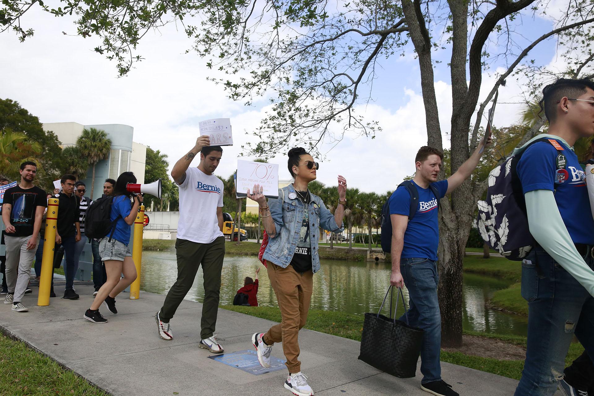 Students chant during the Bernie 2020 March to Early Vote at Florida International University to on Wednesday, March 11, 2020, in Miami. Florida and its 219 delegates could be the knockout punch for presidential hopeful Bernie Sanders after a dismal showing in the Michigan primary. (AP Photo / Brynn Anderson)