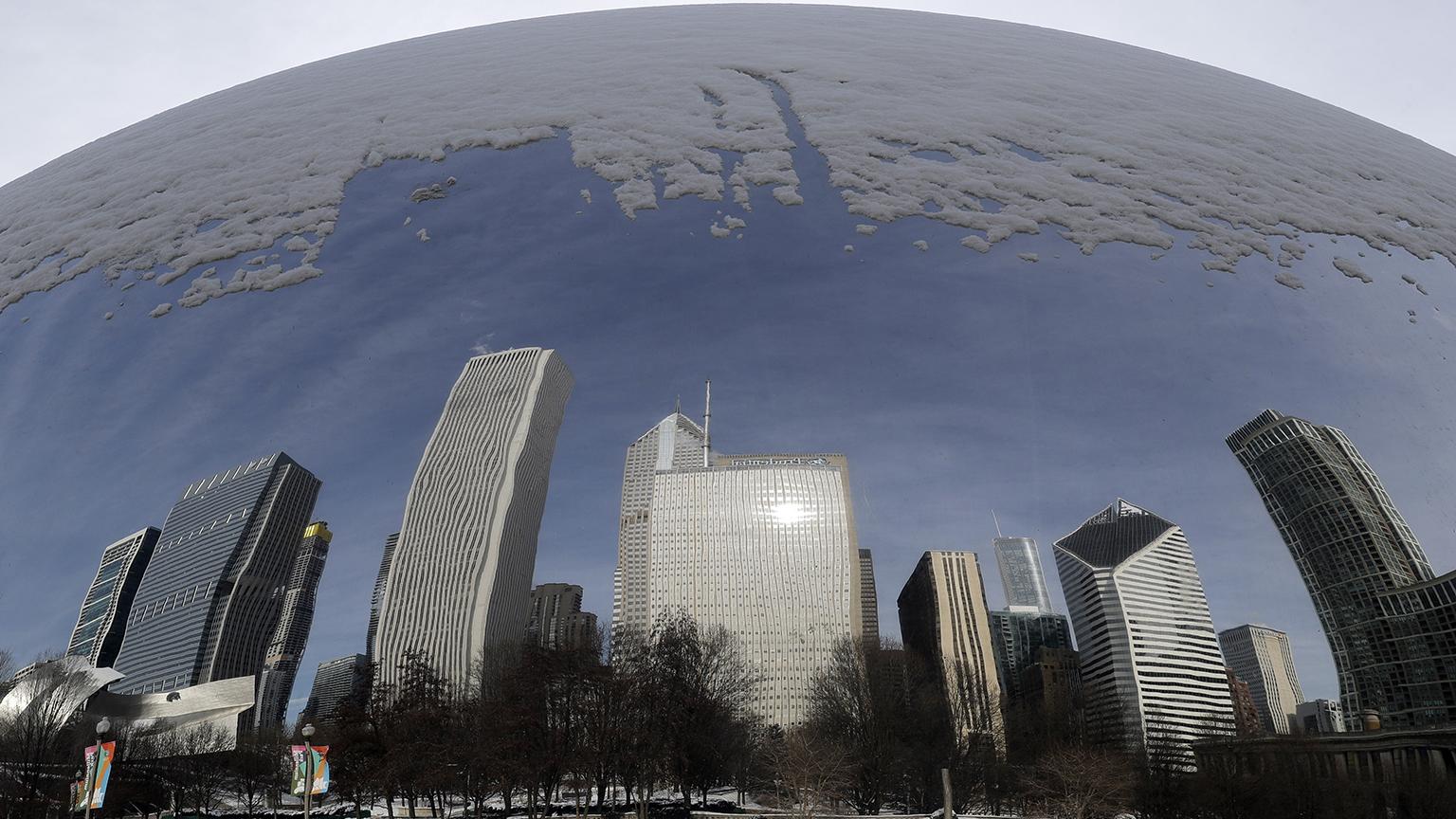 Reflections of a snowy city are seen in the 110-ton stainless steel Anish Kapoor sculpture called “Cloud Gate” at Millennium Park in Chicago, Sunday, Jan. 27, 2019. (AP Photo / Nam Y. Huh)