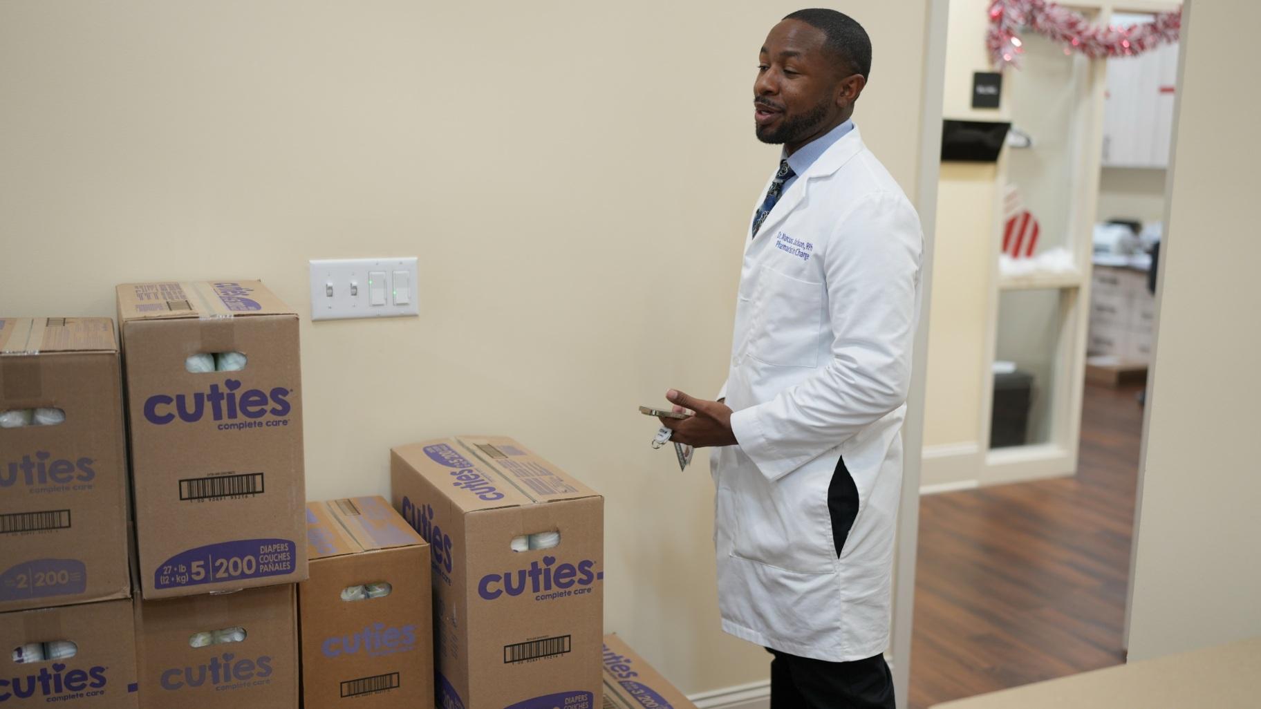 Pharmacist Marcus Johnson gives instructions to an employee Monday, Dec. 9, 2024, in Murfreesboro, Tenn. The pharmacy provides diapers free of charge to customers who qualify through the state's TennCare Diaper Benefit. (AP Photo / George Walker IV)