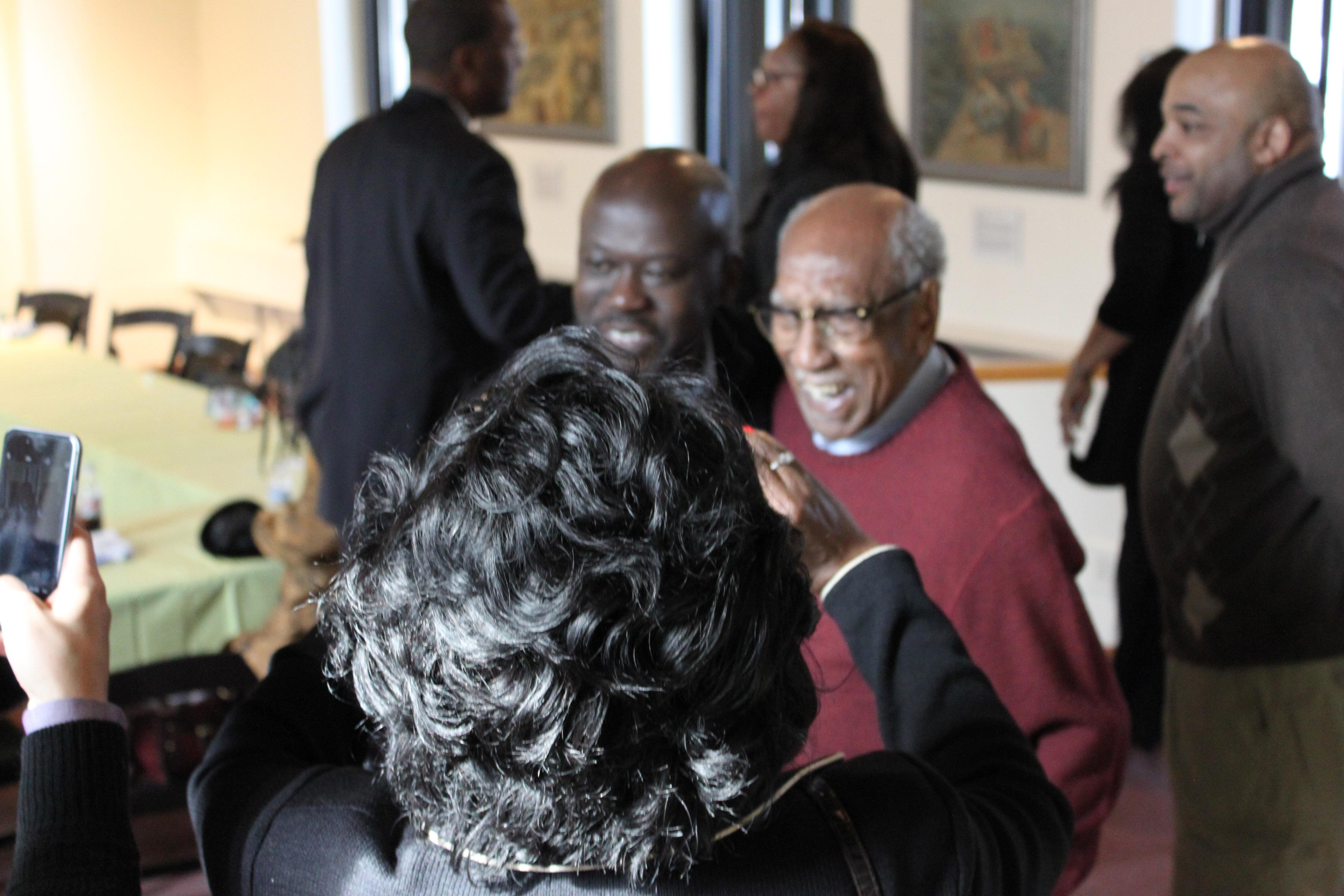 Adjaye takes a photo with historian Timuel Black after Tuesday's meeting.