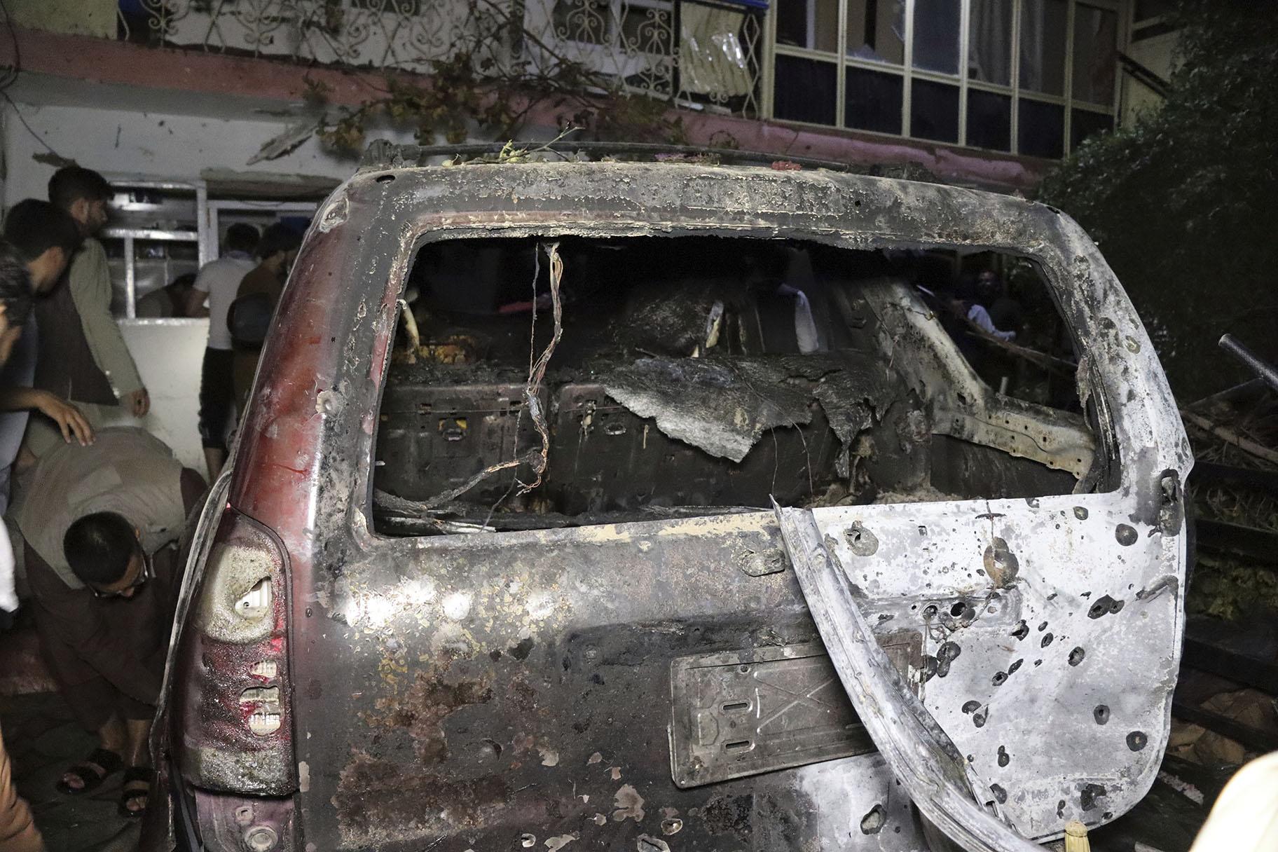 A destroyed vehicle is seen inside a house after a U.S. drone strike in Kabul, Afghanistan, Sunday, Aug. 29, 2021. (AP Photo / Khwaja Tawfiq Sediqi)