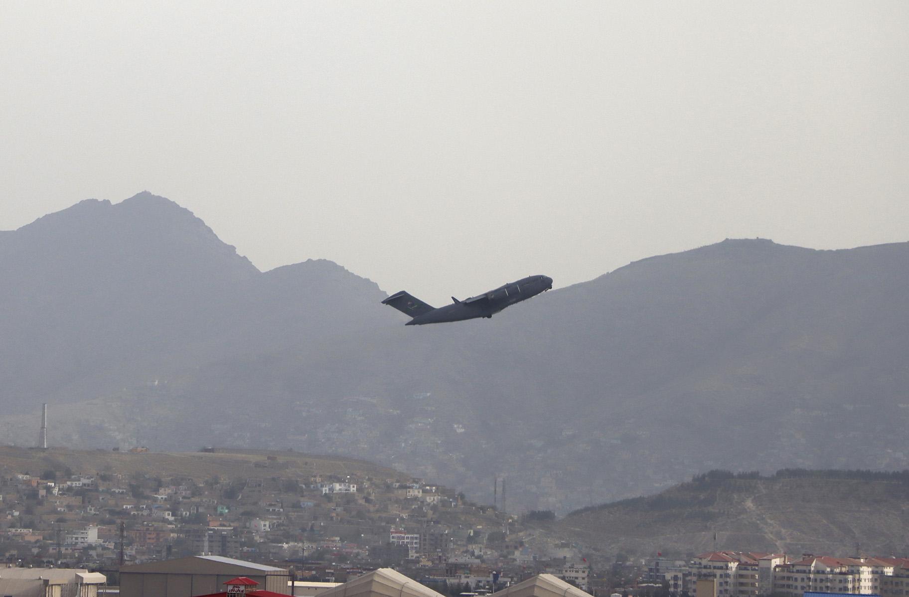 A U.S military aircraft takes off from the Hamid Karzai International Airport in Kabul, Afghanistan, Monday, Aug. 30, 2021. (AP Photo / Wali Sabawoon)