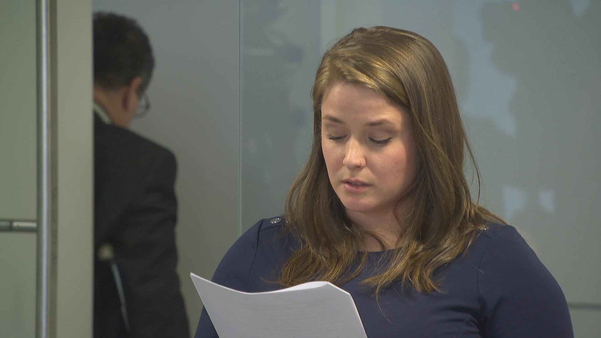 Alaina Hampton reads a statement Tuesday.