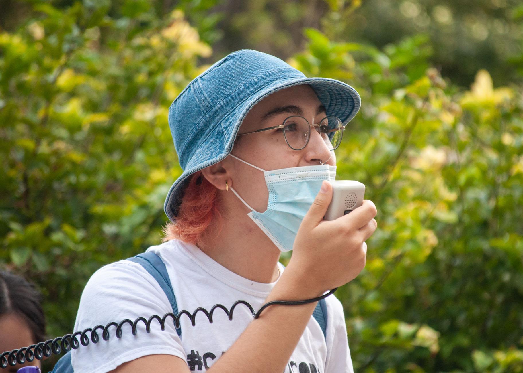 Alicia Hurtado, a third-year student at the University of Chicago and an organizer with Care Not Cops, speaks to student activists during the occupation. (Grace Del Vecchio / WTTW News)