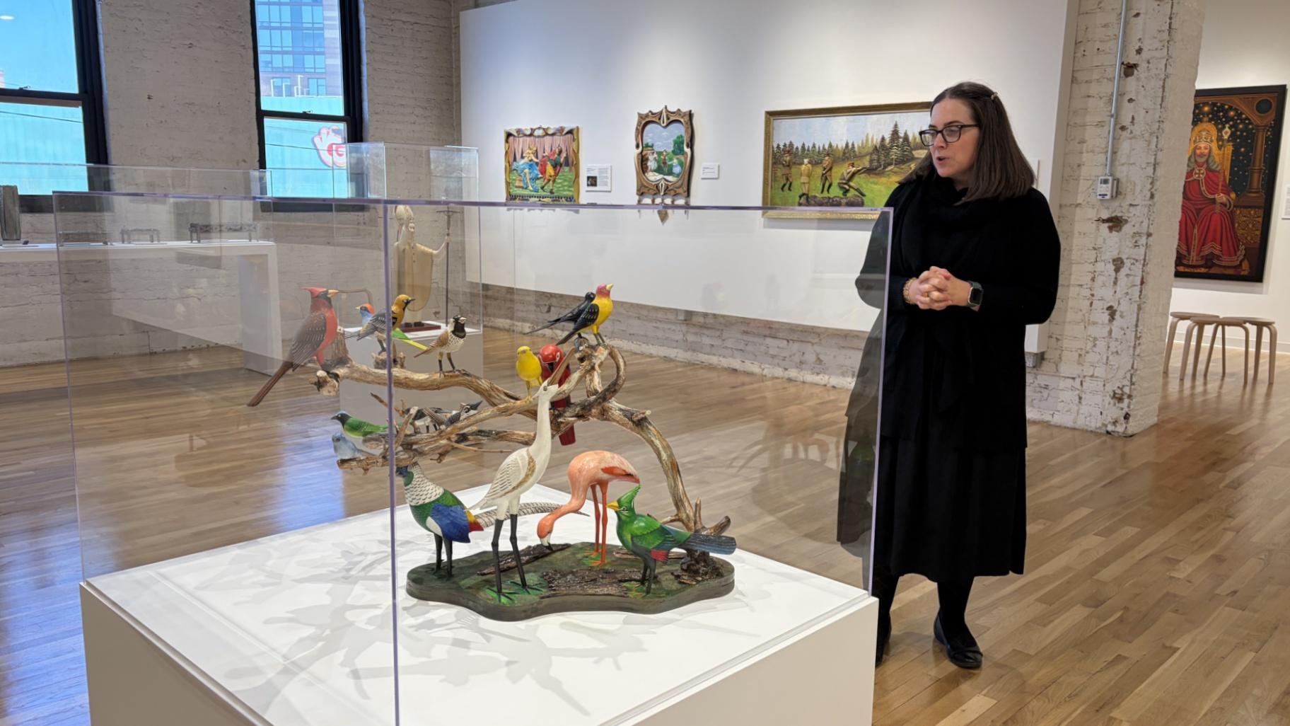 Intuit Art Museum chief curator Alison Amick speaks about the artwork on display in the “Catalyst: Im/migration and Self-Taught Art in Chicago” exhibit, which features work related to migration from nearly two dozen self-taught artists. (Eunice Alpasan / WTTW News)