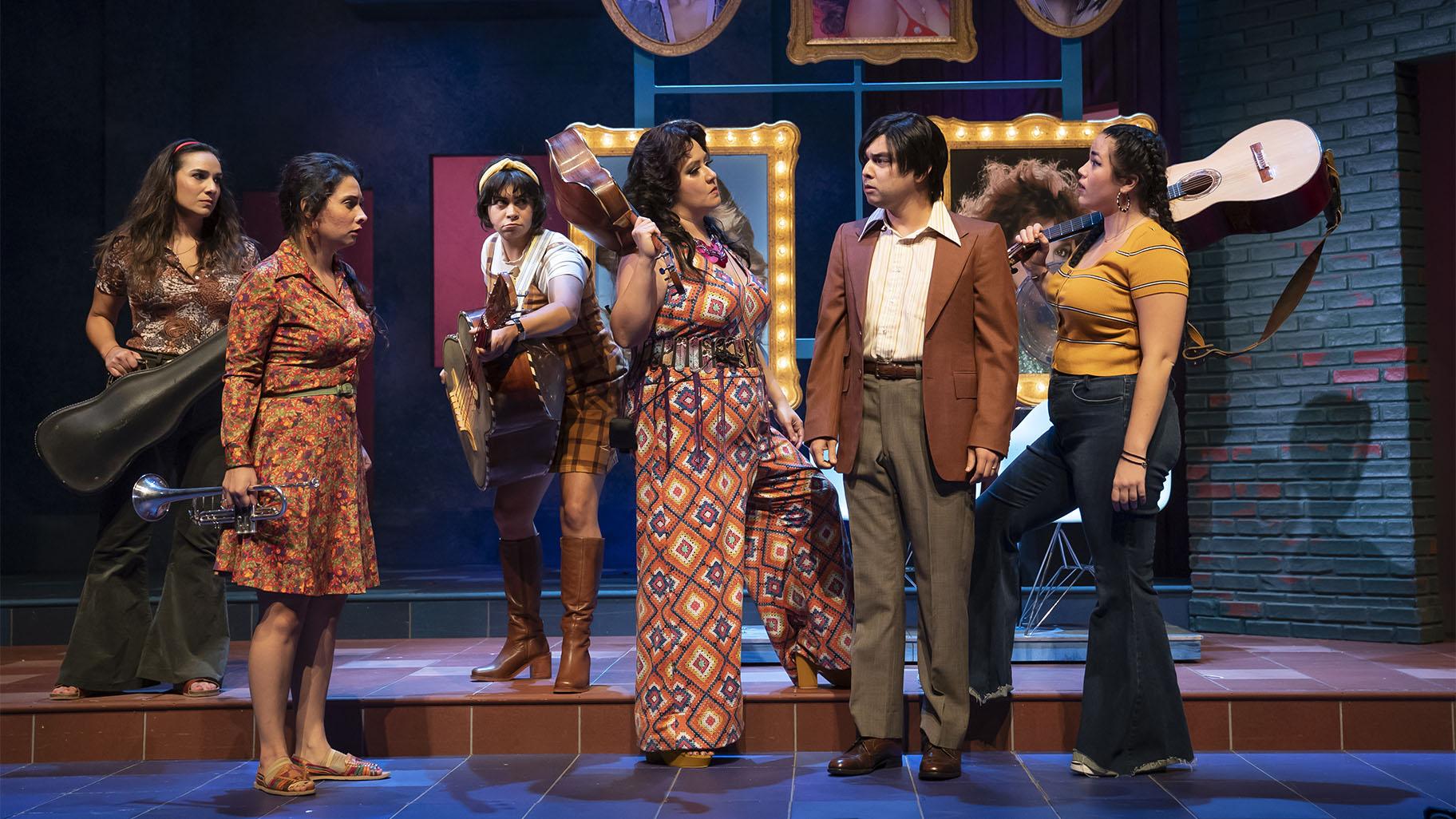 L-R: Tiffany Solano (Lucha), Molly Hernández (Isabel), Amanda Raquel Martinez (Gabby), Gloria Vivica Benavides (Soyla), Christopher Llewyn Ramirez (Mateo) and Lucy Godínez (Boli) in American Mariachi by José Cruz González, directed by Henry Godinez at Goodman Theatre, September 18-October 24, 2021. (Credit Liz Lauren) 