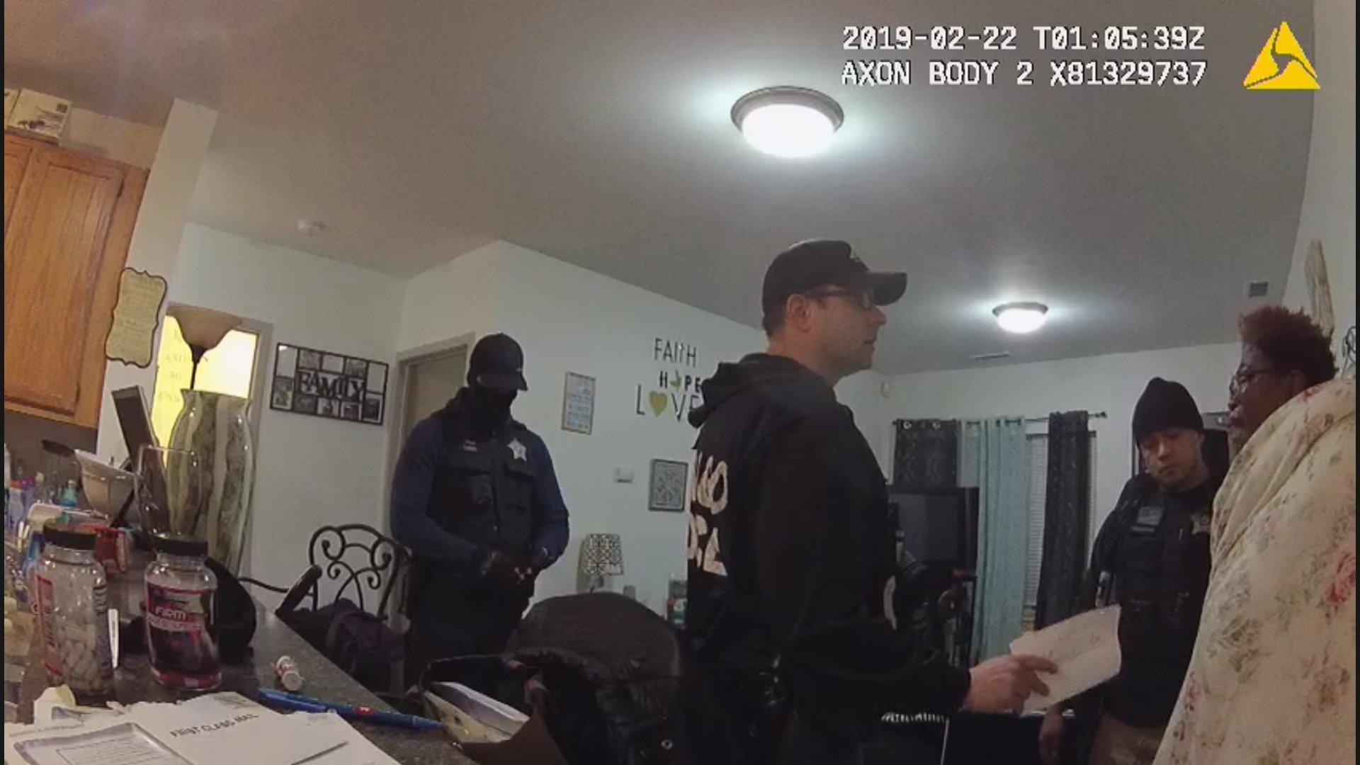 A still image from a Chicago Police Department body camera video shows a police raid at the home of Anjanette Young in February 2019. (WTTW News via Ja’Mal Green)
