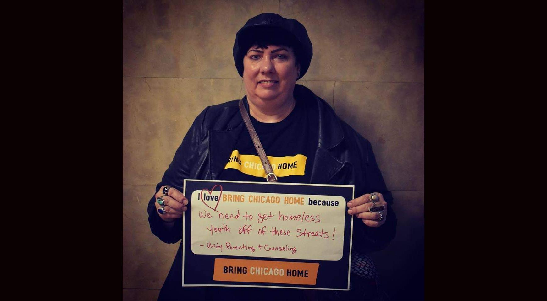 Anne Holcomb, manager of facilities and resources at Ujima Village Homeless Youth Shelter, participates in a demonstration at City Hall before the COVID-19 pandemic began in March 2020. (Credit: The Chicago Coalition for the Homeless)