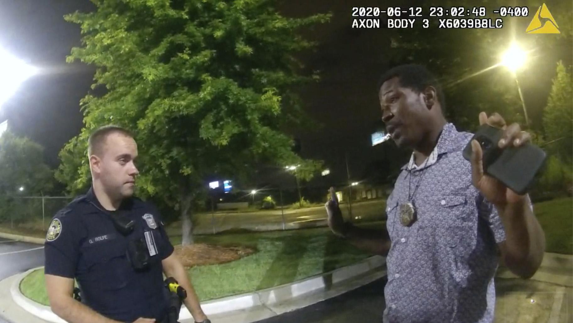 This screen grab taken from body camera video provided by the Atlanta Police Department shows Rayshard Brooks speaking with Officer Garrett Rolfe in the parking lot of a Wendy's restaurant, late Friday, June 12, 2020, in Atlanta. (Atlanta Police Department via AP)