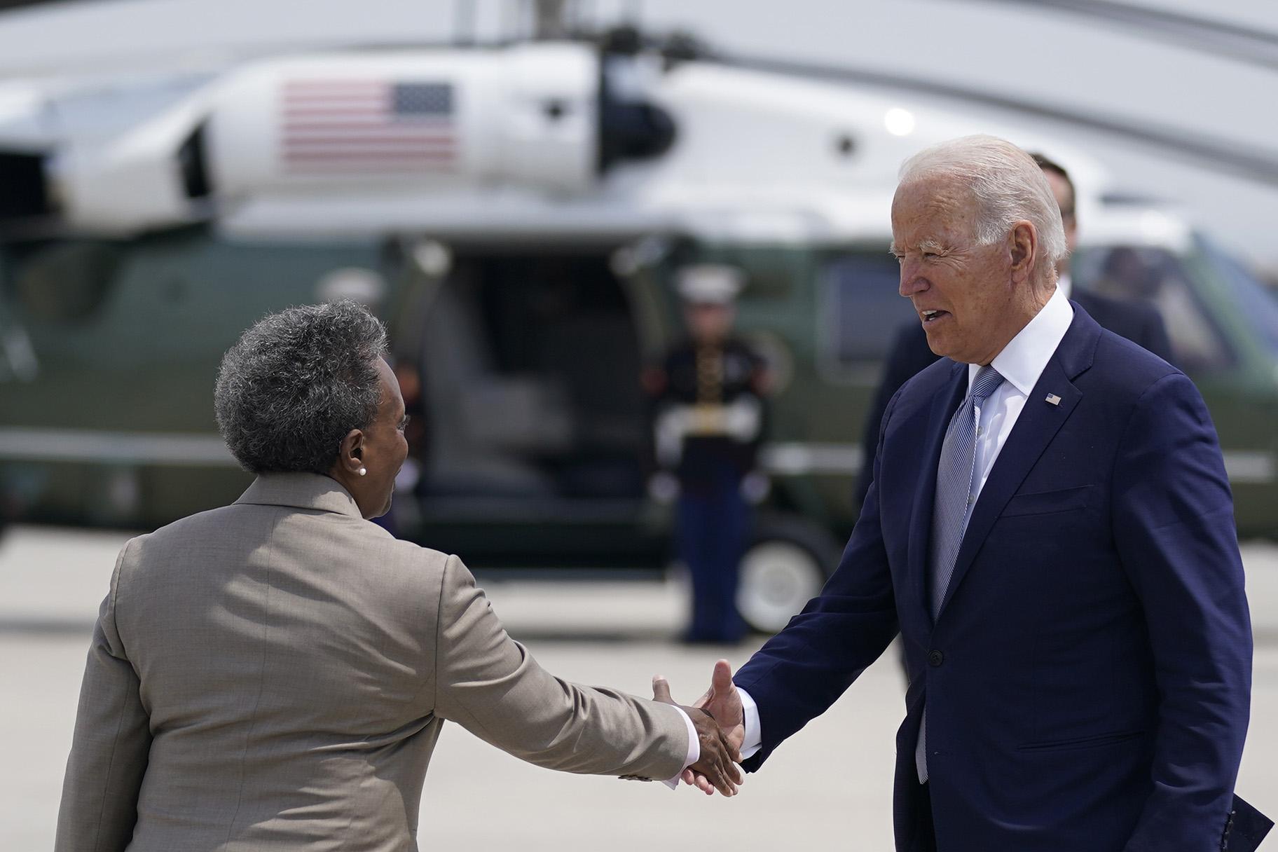 President Joe Biden greets Chicago Mayor Lori Lightfoot as he arrives at O’Hare International Airport, Wednesday, July 7, 2021, in Chicago. (AP Photo / Evan Vucci)