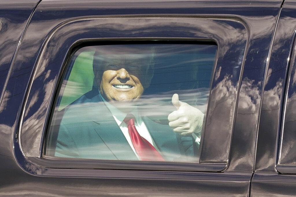 President Donald Trump gestures to supporters en route to his Mar-a-Lago Florida Resort on Wednesday, Jan. 20, 2021, in West Palm Beach, Fla. (AP Photo / Lynne Sladky)