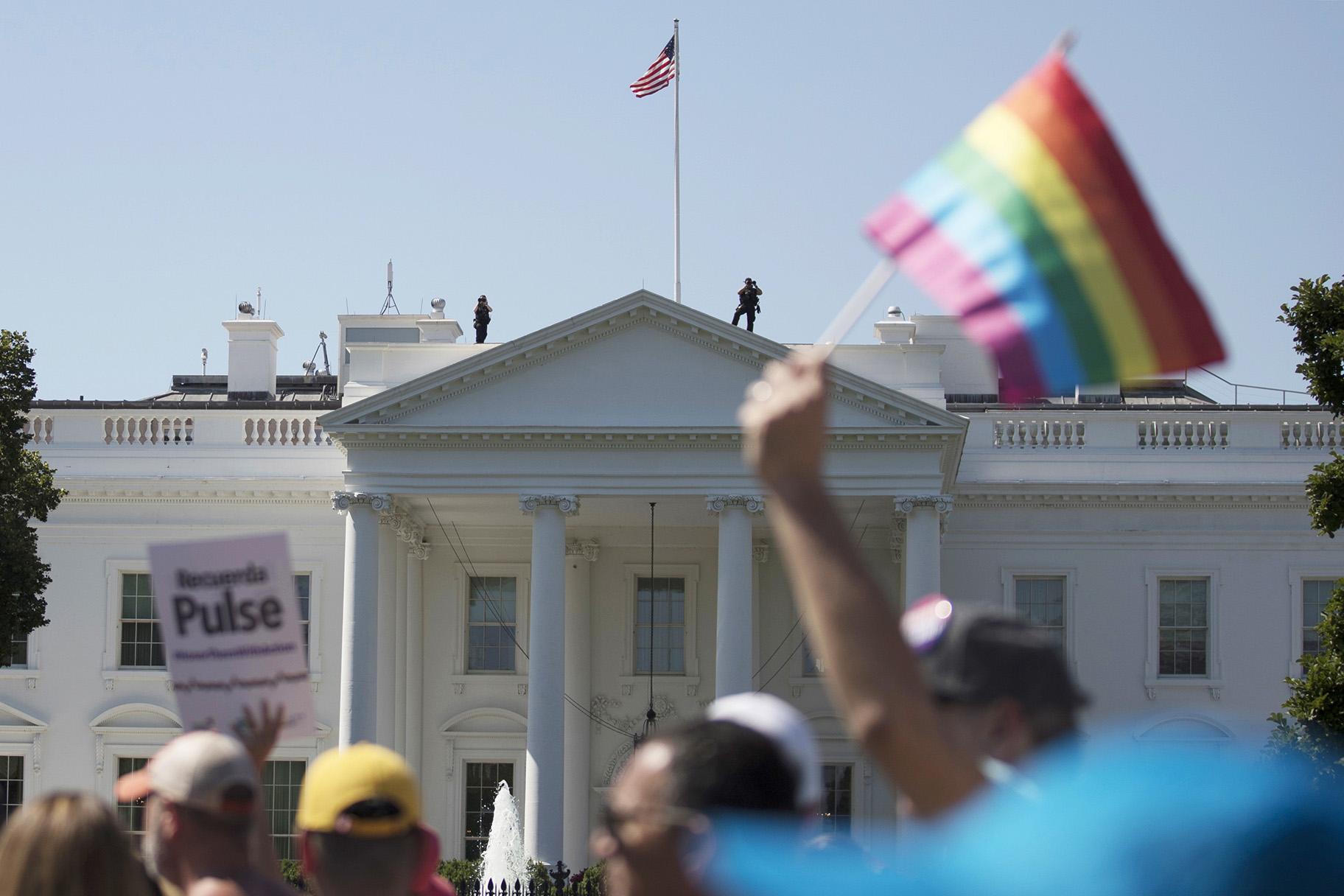 In this Sunday, June 11, 2017 file photo, Equality March for Unity and Pride participants march past the White House in Washington. (AP Photo / Carolyn Kaster)