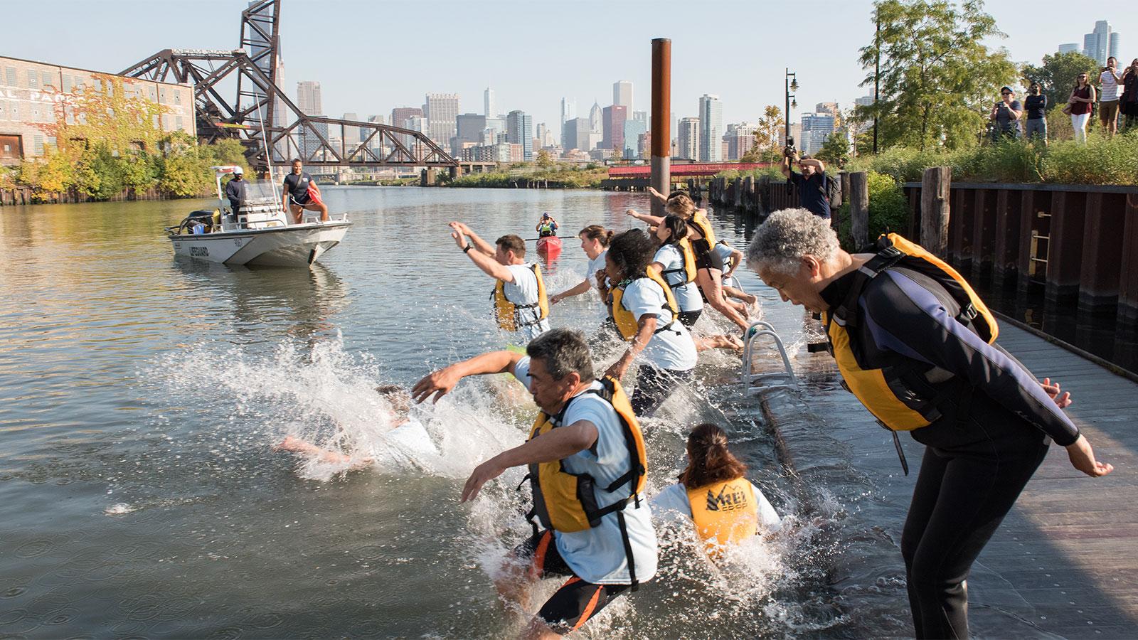 Cook County Board President Toni Preckwinkle and other elected officials jump into the Chicago River during the “Big Jump” event in September 2017. (Courtesy Metropolitan Water Reclamation District)