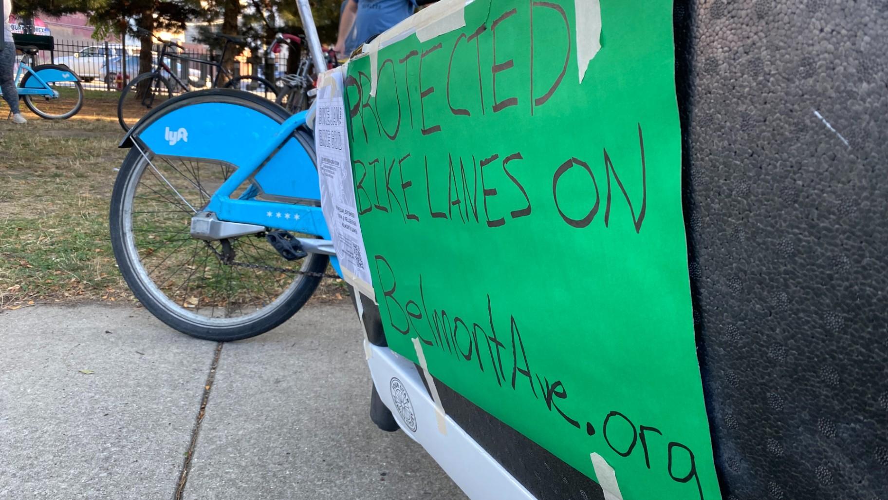 Advocates rally in Roscoe Village’s Fellger Park on Sept. 7, 2022, calling on the city to include more infrastructure upgrades for cyclists, bus passengers, and pedestrians during an upcoming resurfacing of Belmont Avenue. (Nick Blumberg / WTTW News)