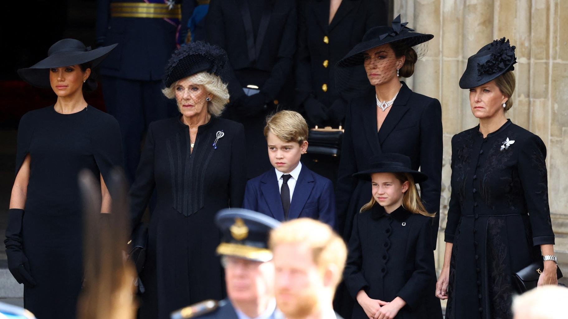 Camilla, Queen Consort, Prince George, Princess Charlotte, Kate, Princess of Wales, Meghan, Duchess of Sussex and Sophie, Countess of Wessex stand after a service at Westminster Abbey on the day of the funeral of 'State and funeral of Britain's Queen Elizabeth in London, Monday, Sept. 19, 2022. (Hannah Mckay/Pool Photo via AP)