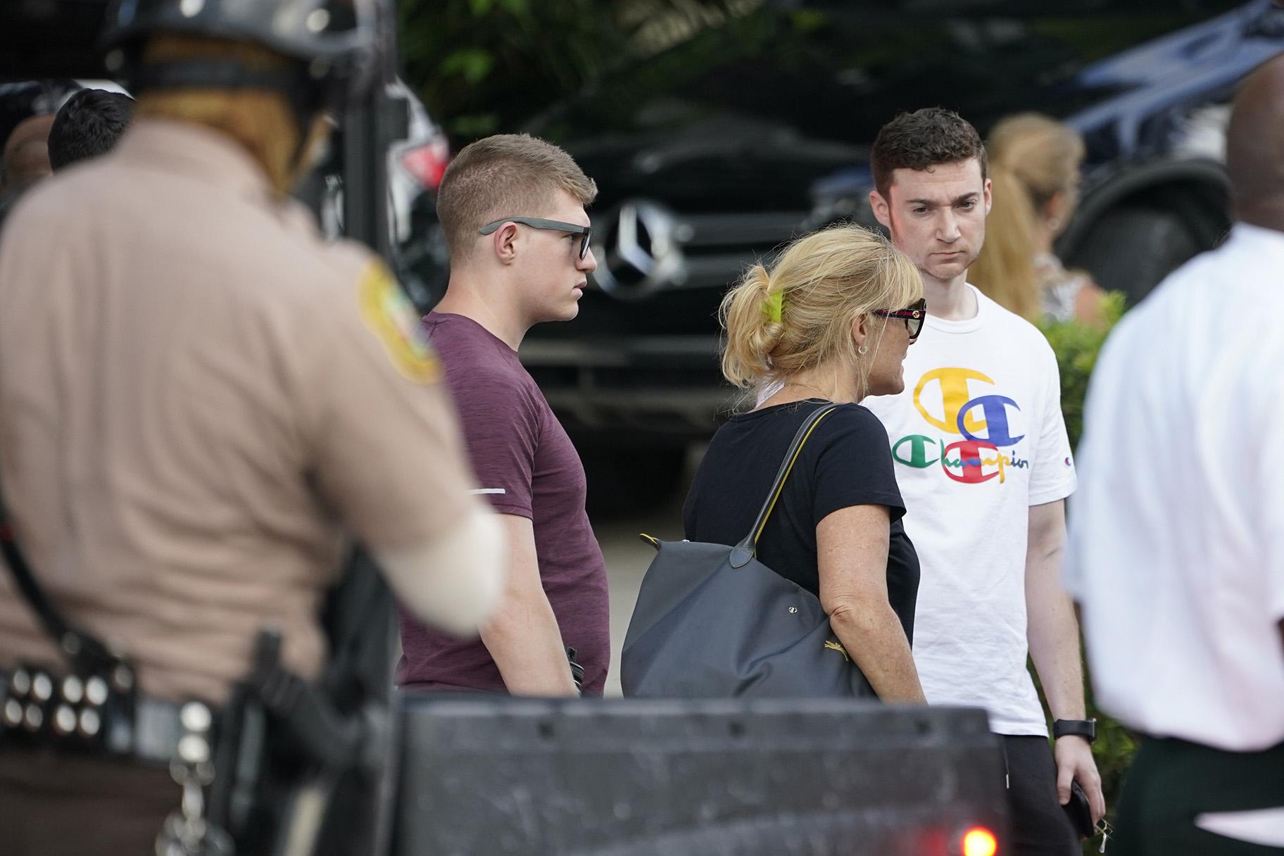 Family members of those missing from Champlain Towers South Condo collapse arrive back at the reunification center after visiting the scene in Surfside, Fla., Sunday, June 27, 2021. Rescuers keep digging through the mound of rubble and clinging to hope that someone could be found alive. (AP Photo / Marta Lavandier)