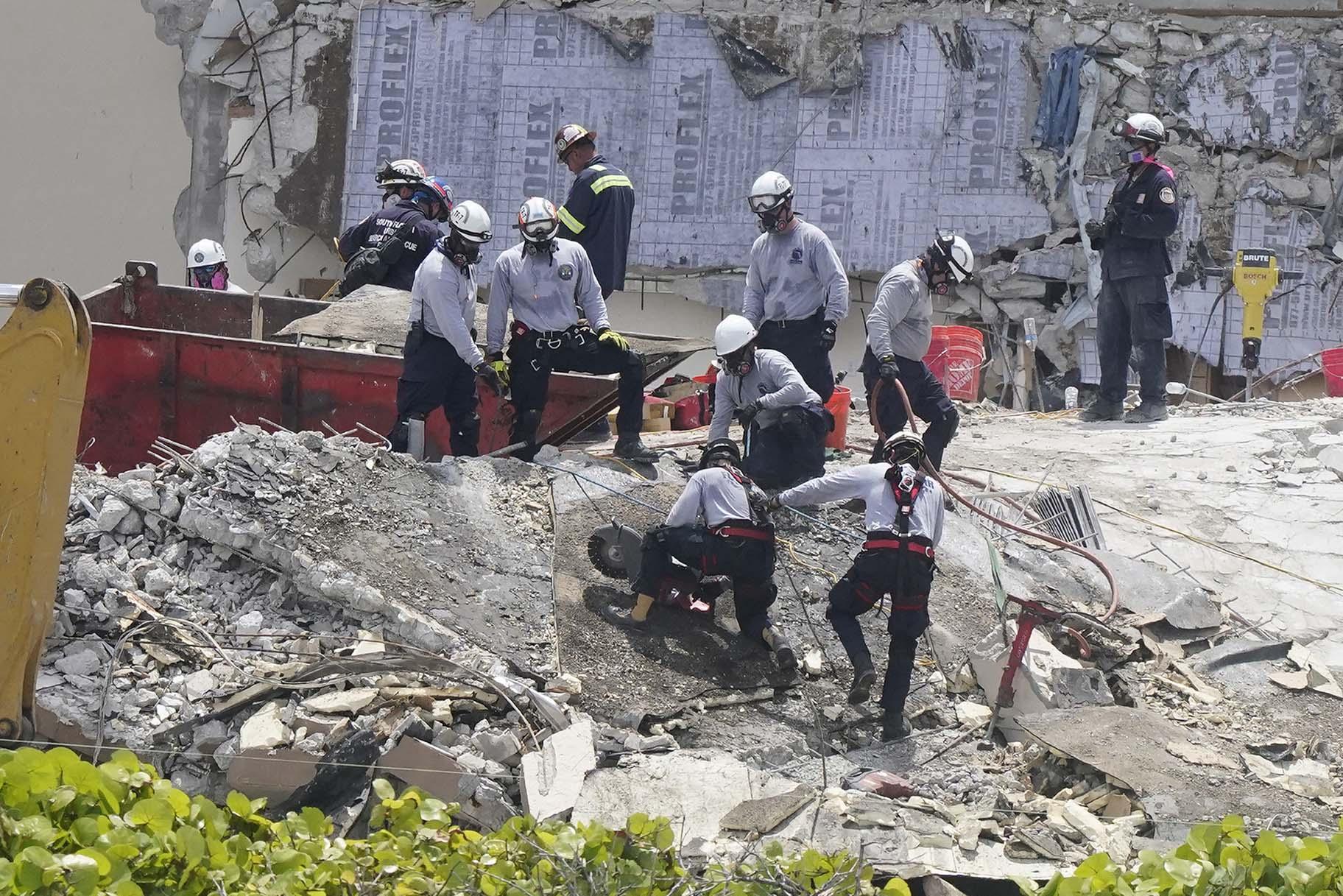 Workers cut a large slab of concrete at the Champlain Towers South condo, Monday, June 28, 2021, in Surfside, Fla. Many people were still unaccounted for after Thursday’s fatal collapse. (AP Photo / Marta Lavandier)