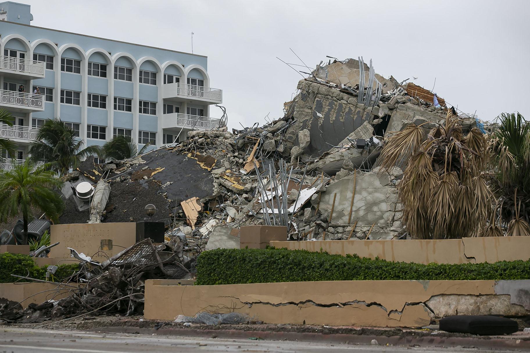 Rubble and debris of the Champlain Towers South condo can be seen Tuesday, July 6, 2021 in Surfside, Fla. (Carl Juste / Miami Herald via AP)