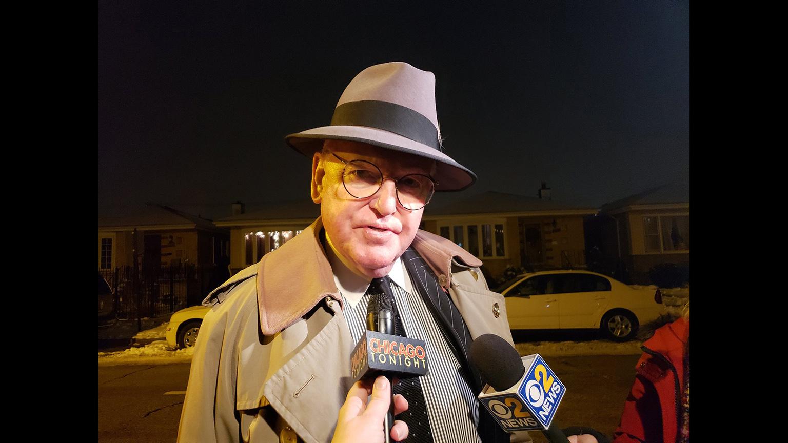 Ald. Ed Burke speaks with “Chicago Tonight” reporter Amanda Vinicky and other reporters outside his home on Thursday, Nov. 29, hours after FBI agents raided his offices. (WTTW News)