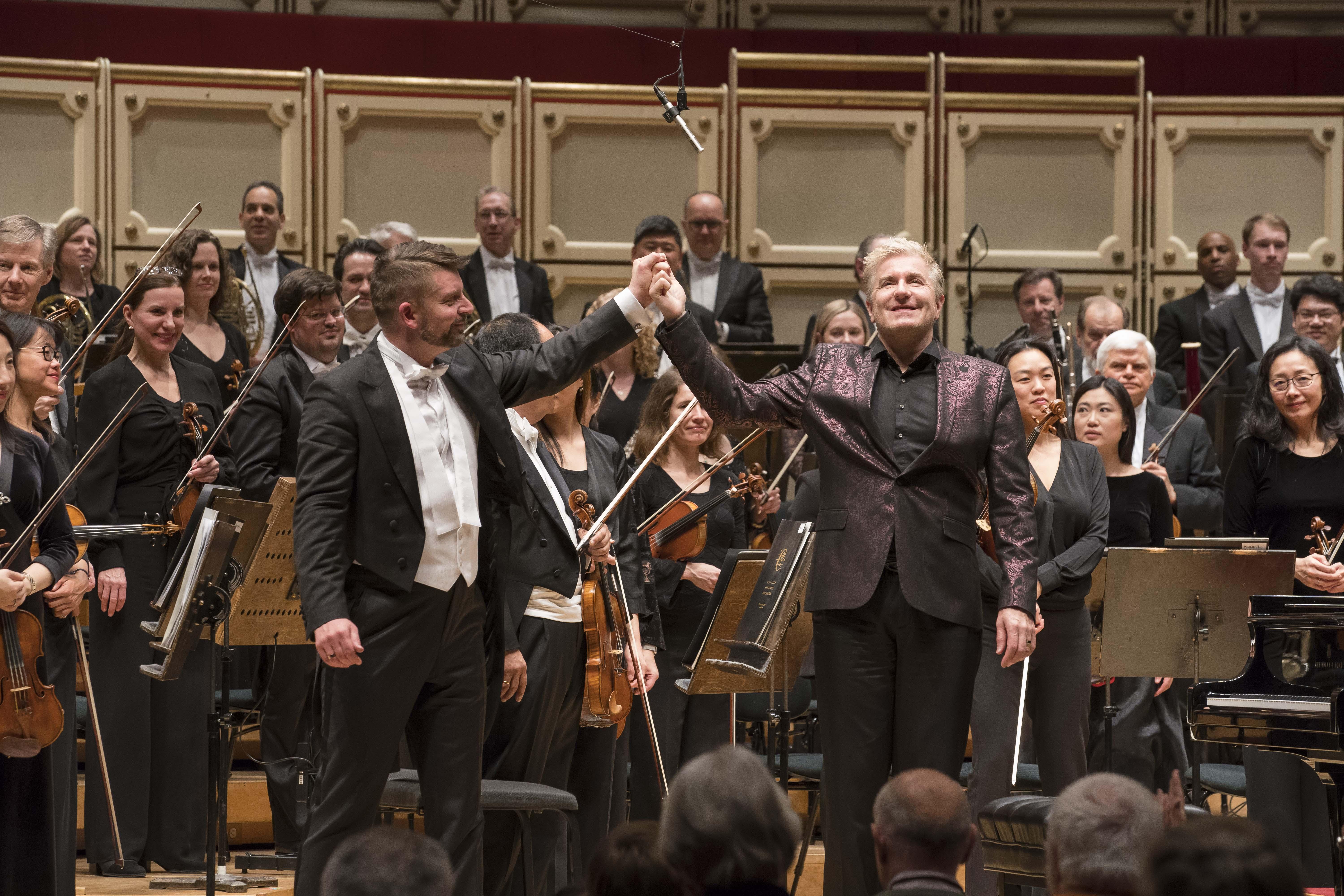 Guest conductor Matthias Pintscher congratulates pianist Jean-Yves Thibaudet following their performance of Ravel’s “Piano Concerto for the Left Hand” with the CSO. (Photo © Todd Rosenberg)