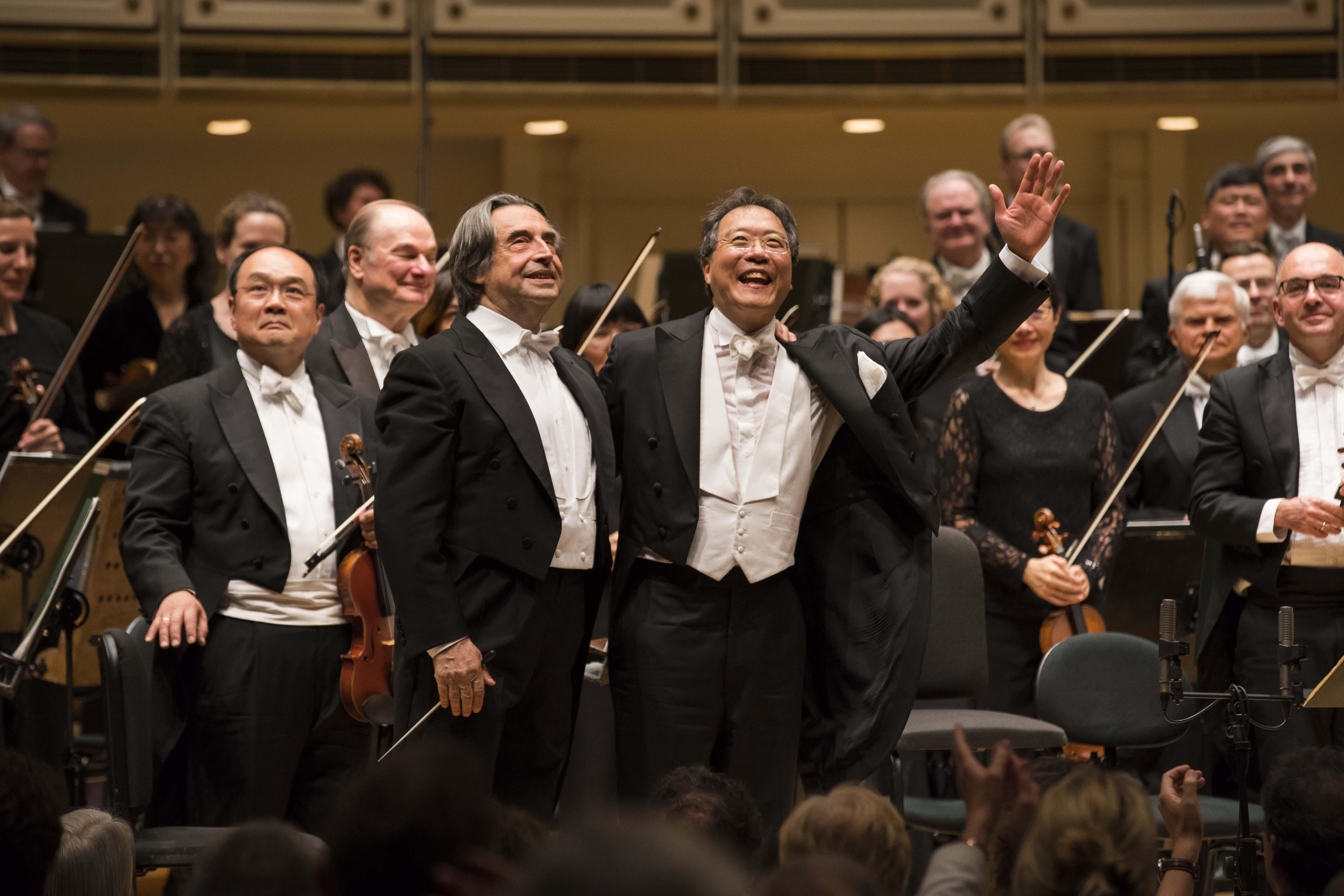 Music Director Riccardo Muti and cellist Yo-Yo Ma acknowledge the audience following their performance of Shostakovich’s Cello Concerto No. 2 with the CSO. (Credit: Todd Rosenberg Photography)