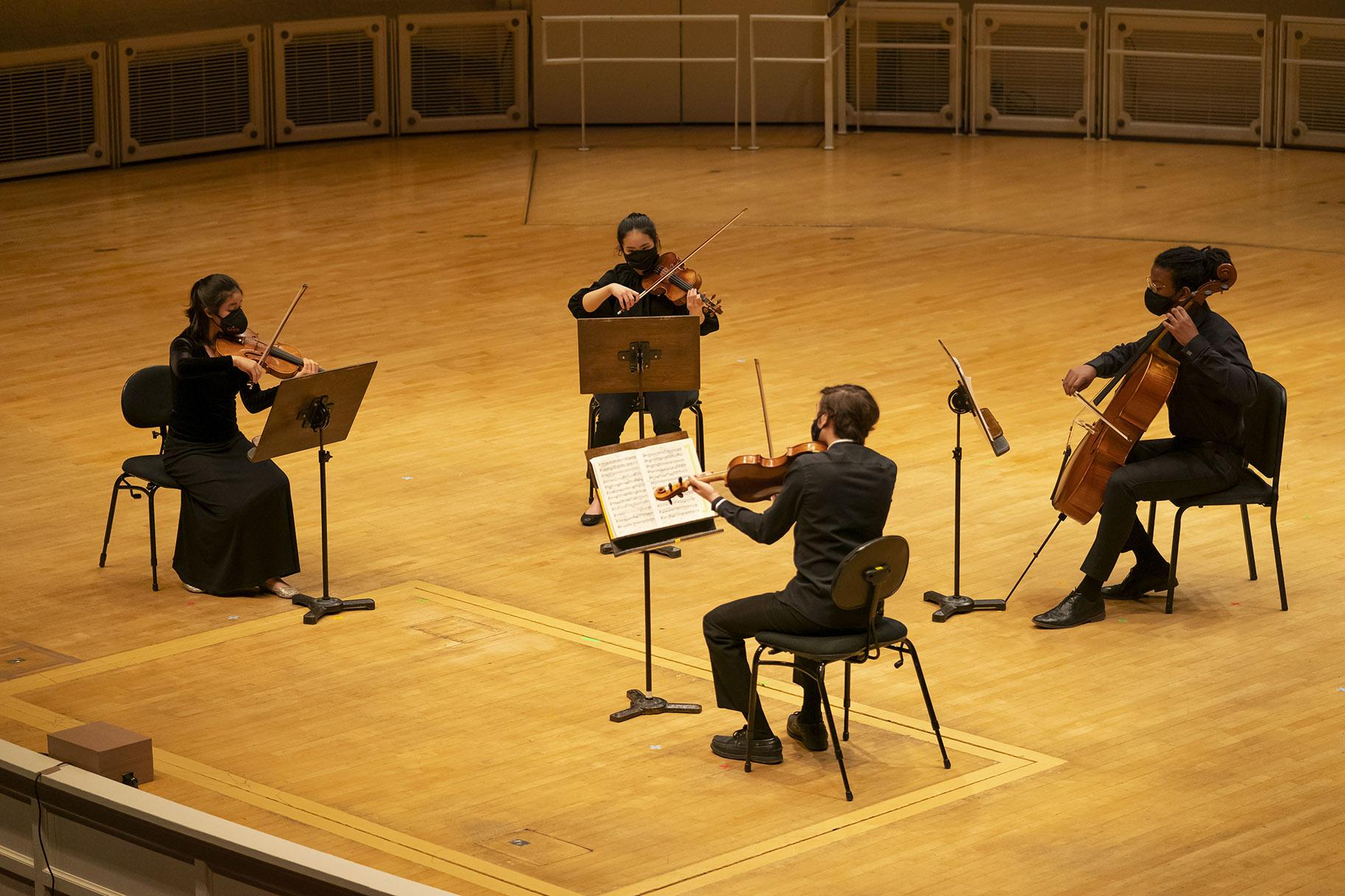 Clockwise, from left: CMPI fellows Esme Arias-Kim, Ella Saputra, Jonathan Miller and Sameer Agrawal. (Credit: Todd Rosenberg)