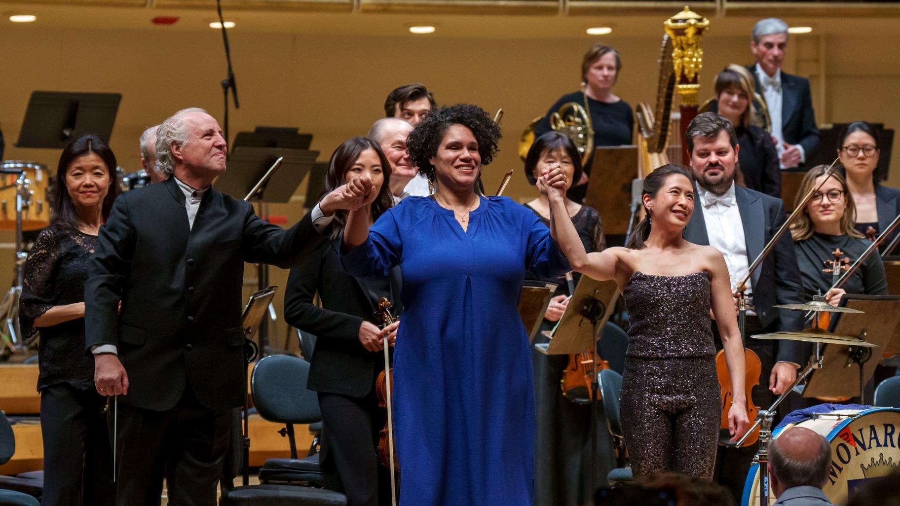 Conductor Manfred Honeck, CSO Mead Composer-in-Residence Jessie Montgomery and CSO principal percussionist Cynthia Yeh acknowledge audience applause following the world-premiere performance of Montgomery’s “Procession” with the Chicago Symphony Orchestra. (Todd Rosenberg)