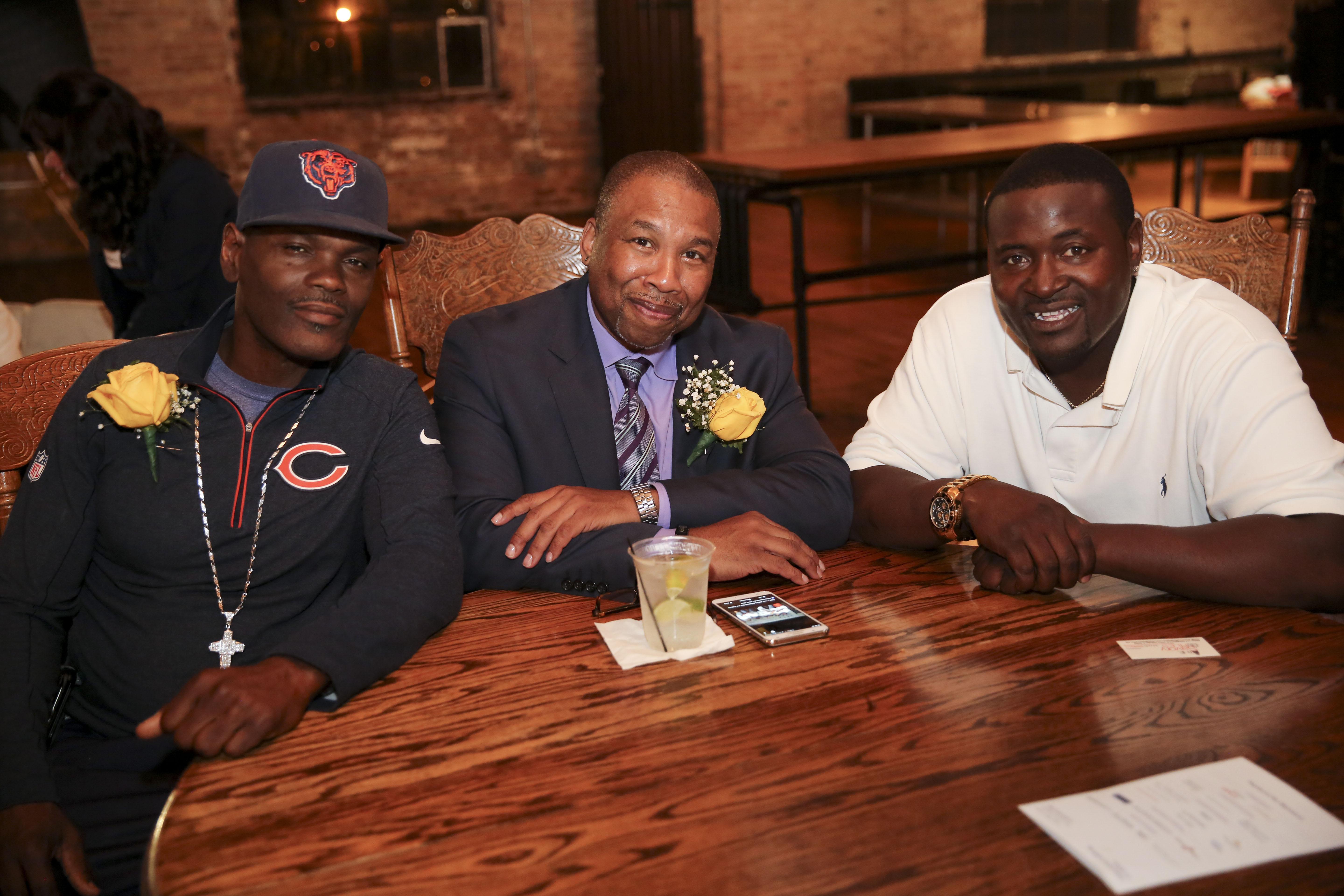 Dana Holland, left, with exonerees Johnnie Savory, center, and Christopher Coleman at a Center on Wrongful Convictions benefit in November 2016. (Credit: Jasmin Shah)