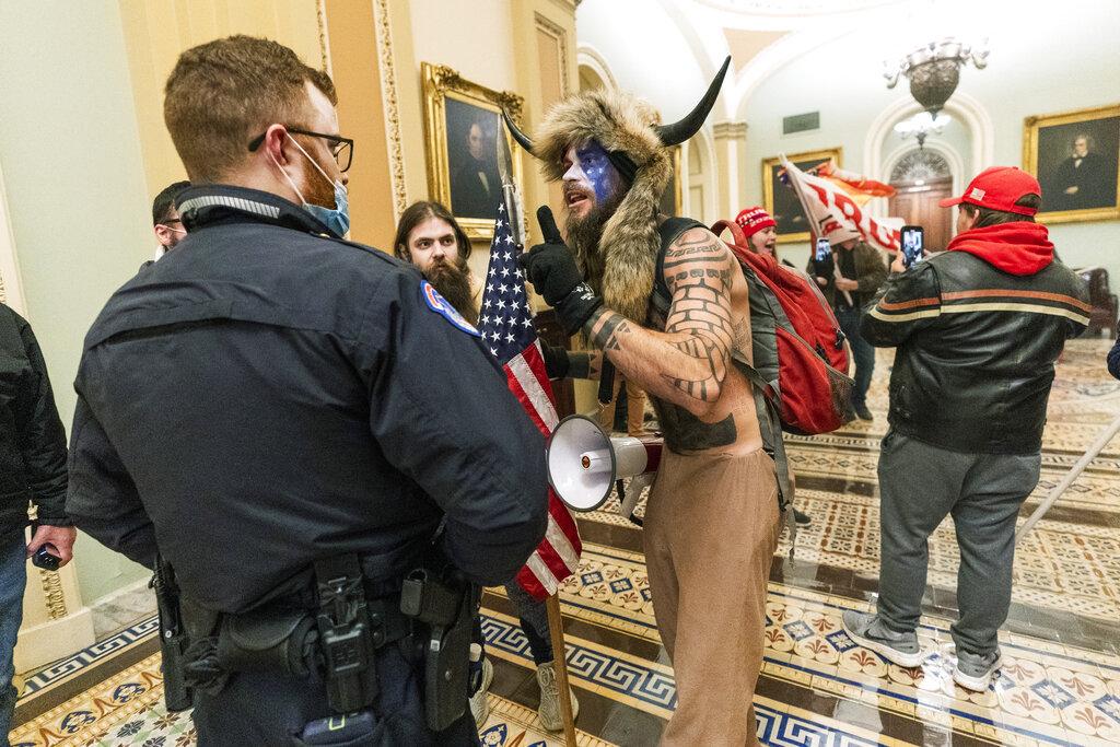 In this Jan. 6, 2021, file photo supporters of President Donald Trump are confronted by U.S. Capitol Police officers outside the Senate Chamber inside the Capitol in Washington. (AP Photo / Manuel Balce Ceneta, File)