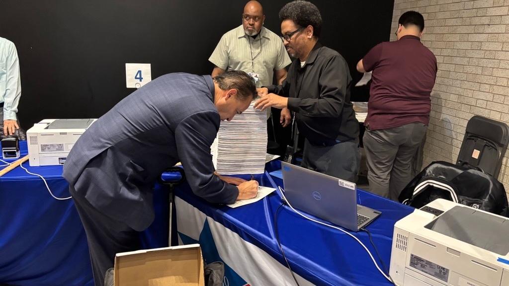 Cook County Board of Review member George Cardenas turns in his petitions to run for mayor of Chicago on Oct. 26, 2026. (Heather Cherone / WTTW News)