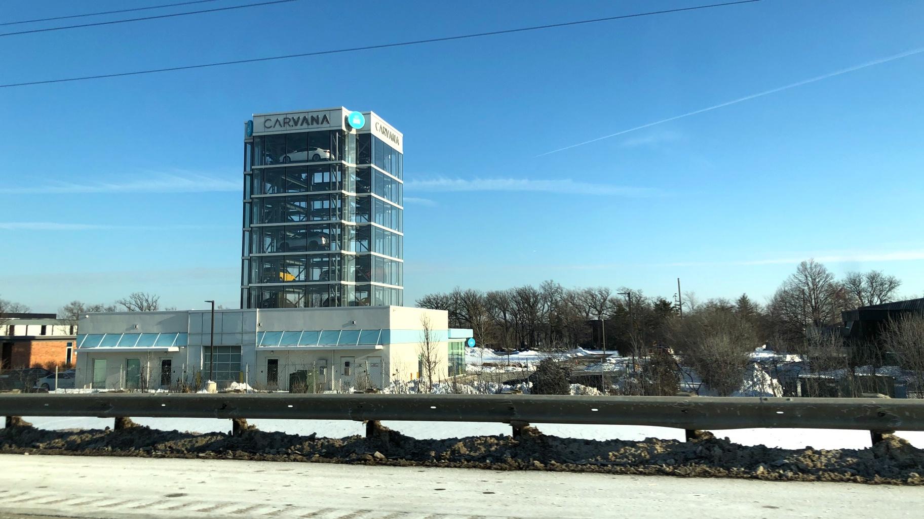 An eight-story Carvana tower in Oak Brook, as seen from I-88. (Patty Wetli / WTTW News)