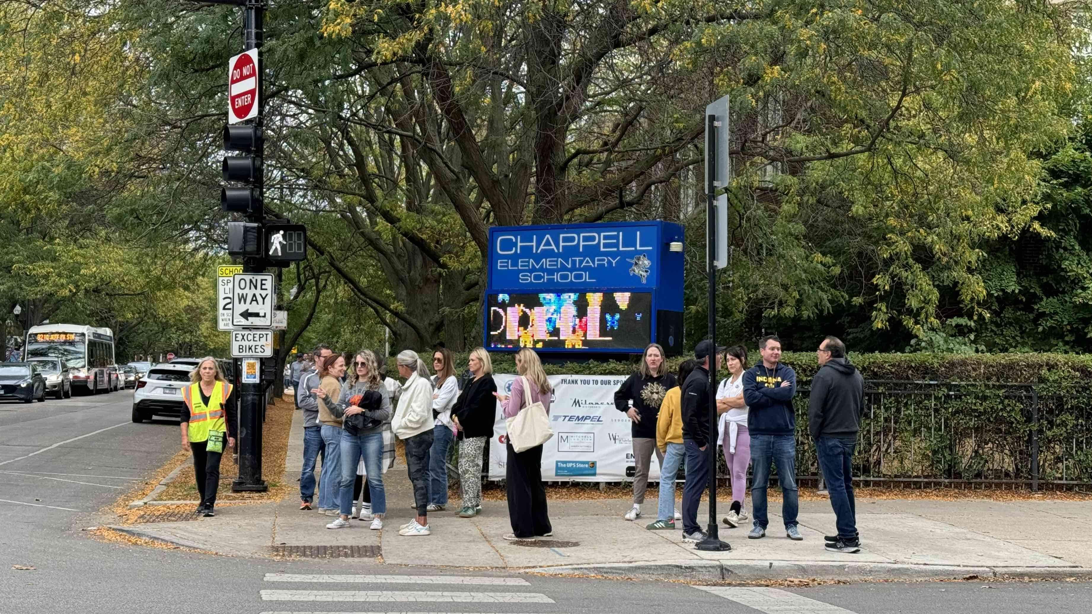 Community members outside Chappell Elementary during Friday’s afternoon dismissal on Oct. 10, 2025. (Patty Wetli / WTTW News)