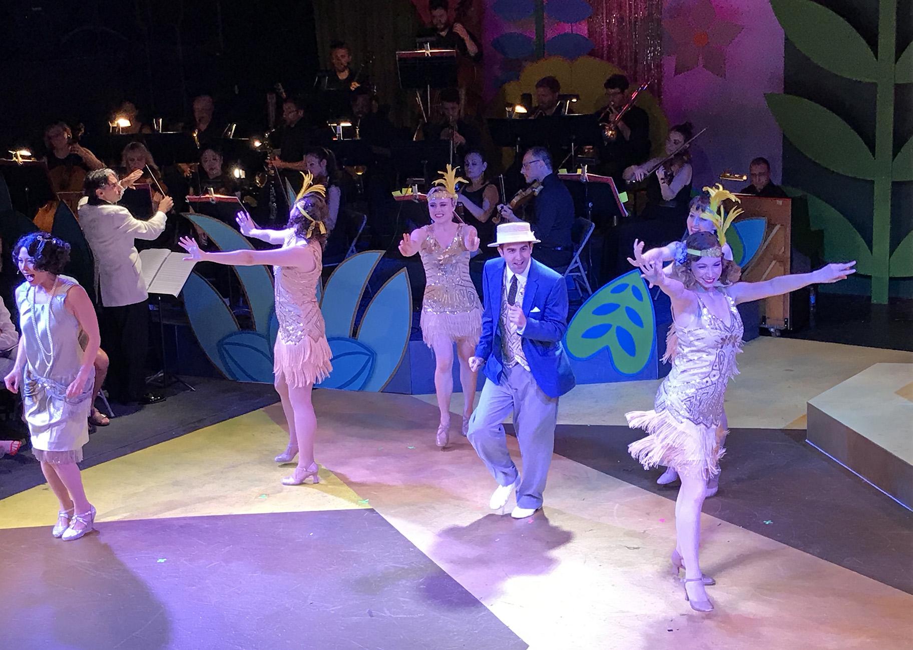 From left: Marisa Buchheit, Sarah Ruth Mikulski, Jordan Beyeler, Ryan Trent Oldham, Athena Kopulos, Teaira Burge, with Anthony Barrese conducting the orchestra. (Courtesy of Folks Operetta)