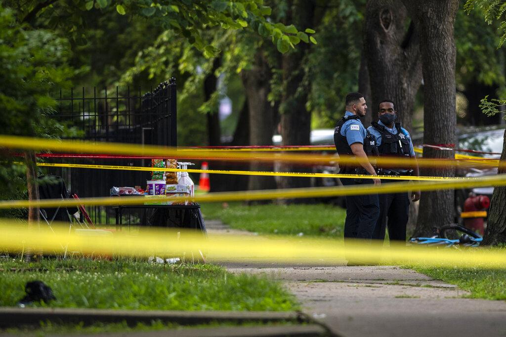 Chicago police investigate the scene where multiple people were shot in the 8200 block of South Drexel, in the Chatham neighborhood of Chicago, Friday, July 17, 2020. (Tyler LaRiviere / Chicago Sun-Times via AP)