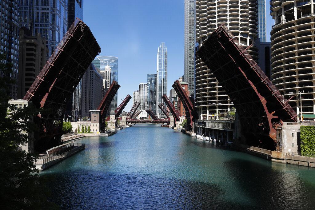 In this May 31, 2020 file photo, several street bridges over the Chicago River remain closed in Chicago, after a night of unrest and protests over the death of George Floyd, a Black man who was in police custody in Minneapolis. (AP Photo / Charles Rex Arbogast)